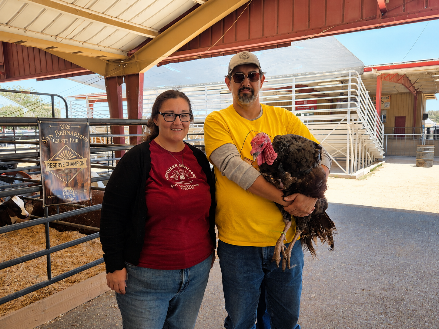 Dannielle Chavera and Andre Guerrero of Guerrero Heritage Ranch with a turkey at the San Bernardino County Fair.