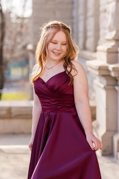 Teen girl in burgundy formal dress curties