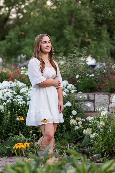 Teen girl surrounded by flowers at Gibson Park
