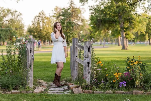 Teen girl touches her hair during senior photo session at Gibson Park