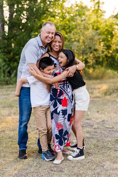 Happy family hugs each other during Great Falls MT family photo session