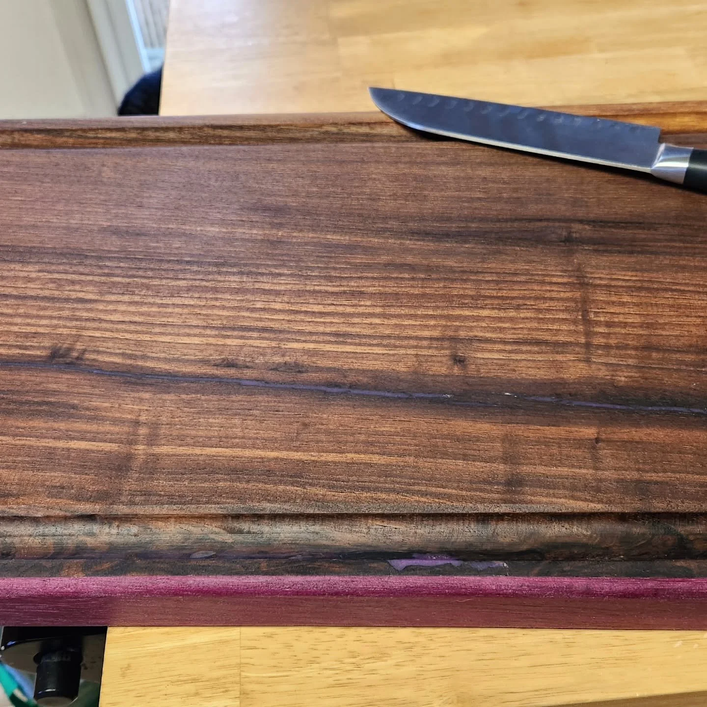 Large carving board I made for my wife. It's walnut with a thin strip of purpleheart. #cuttingboards #cuttingboard #carvingboard