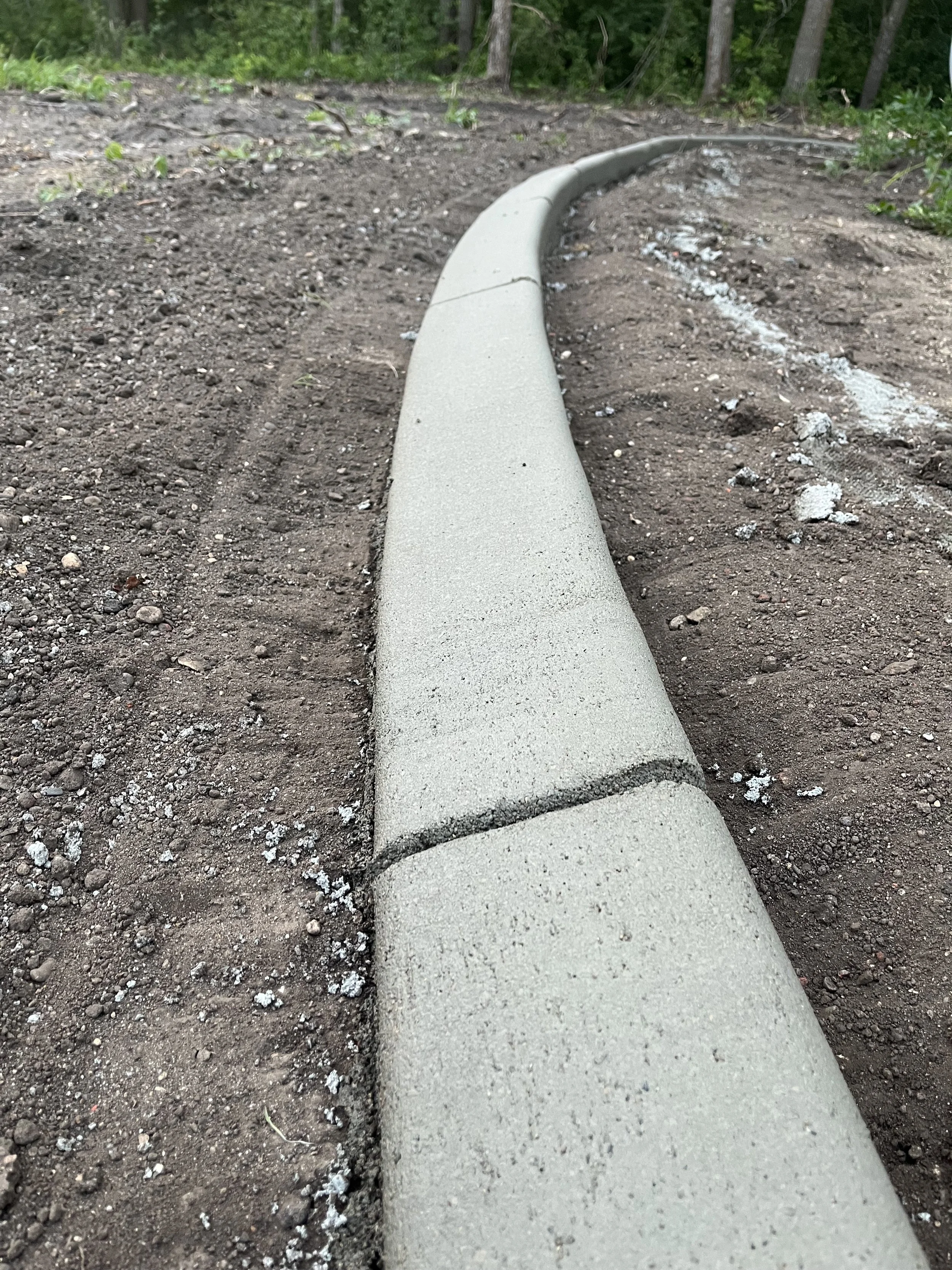 Close Up Smooth Concrete Landscape Edging in Lakes Area Minnesota