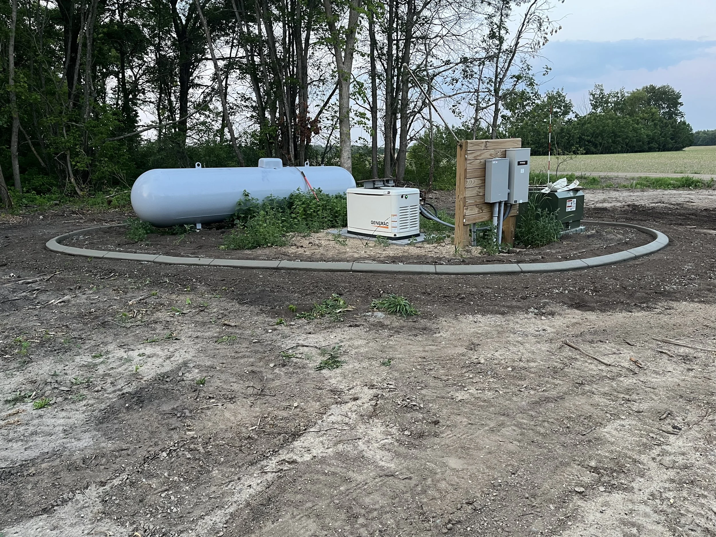 Custom Concrete Landscape Edging Around Residential Utilites