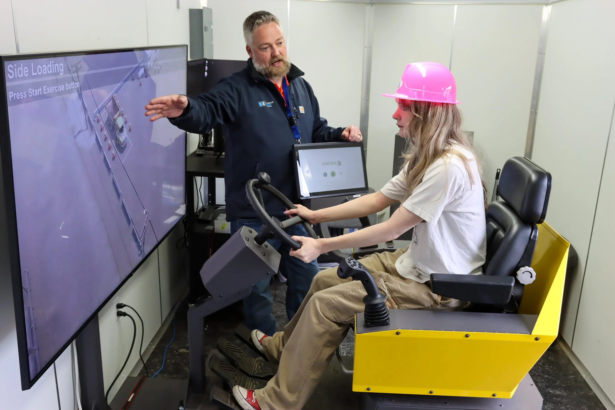 Instructor and student in a driving simulator