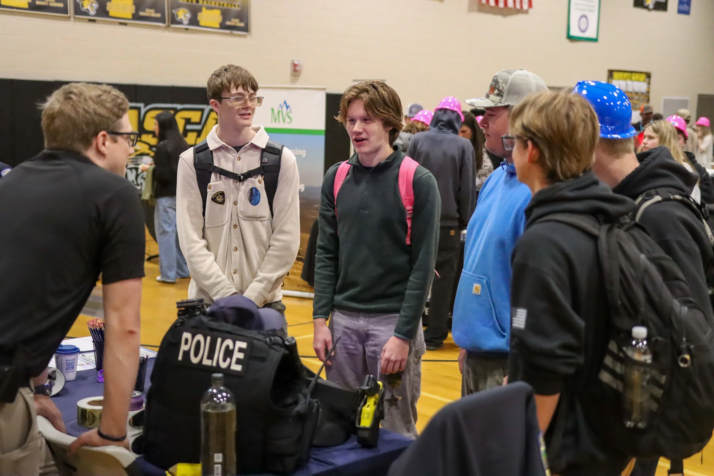 Students talking with police at the career fair