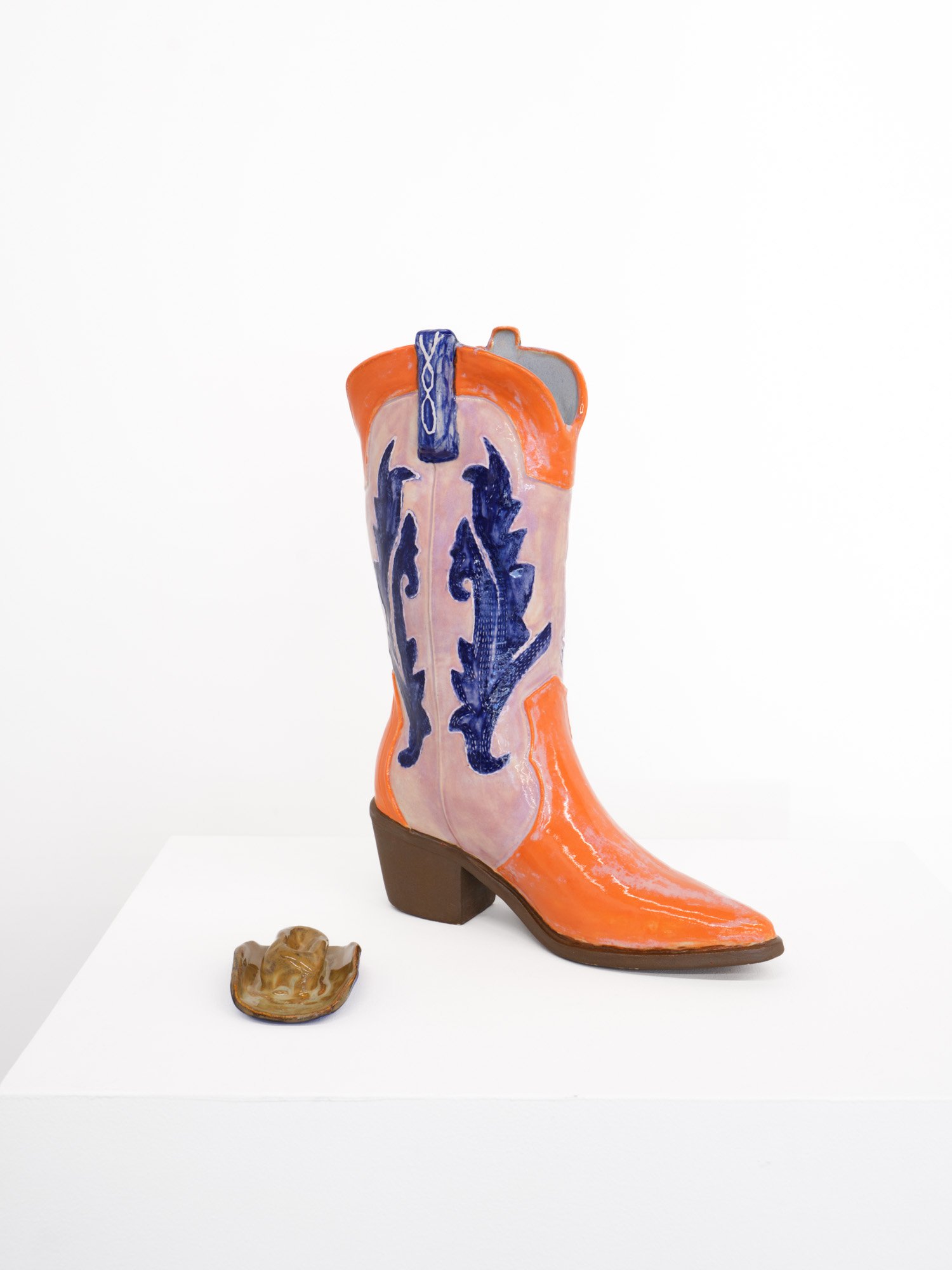 Cindy Elizabeth 
Boots on the Ground #2, 2026 
Ceramic cast of cowboy boot, glaze 
Boot: 9 (l) x 12 (h) x 2.5 (d) inches; hat: 4 x 2 x 2 inches