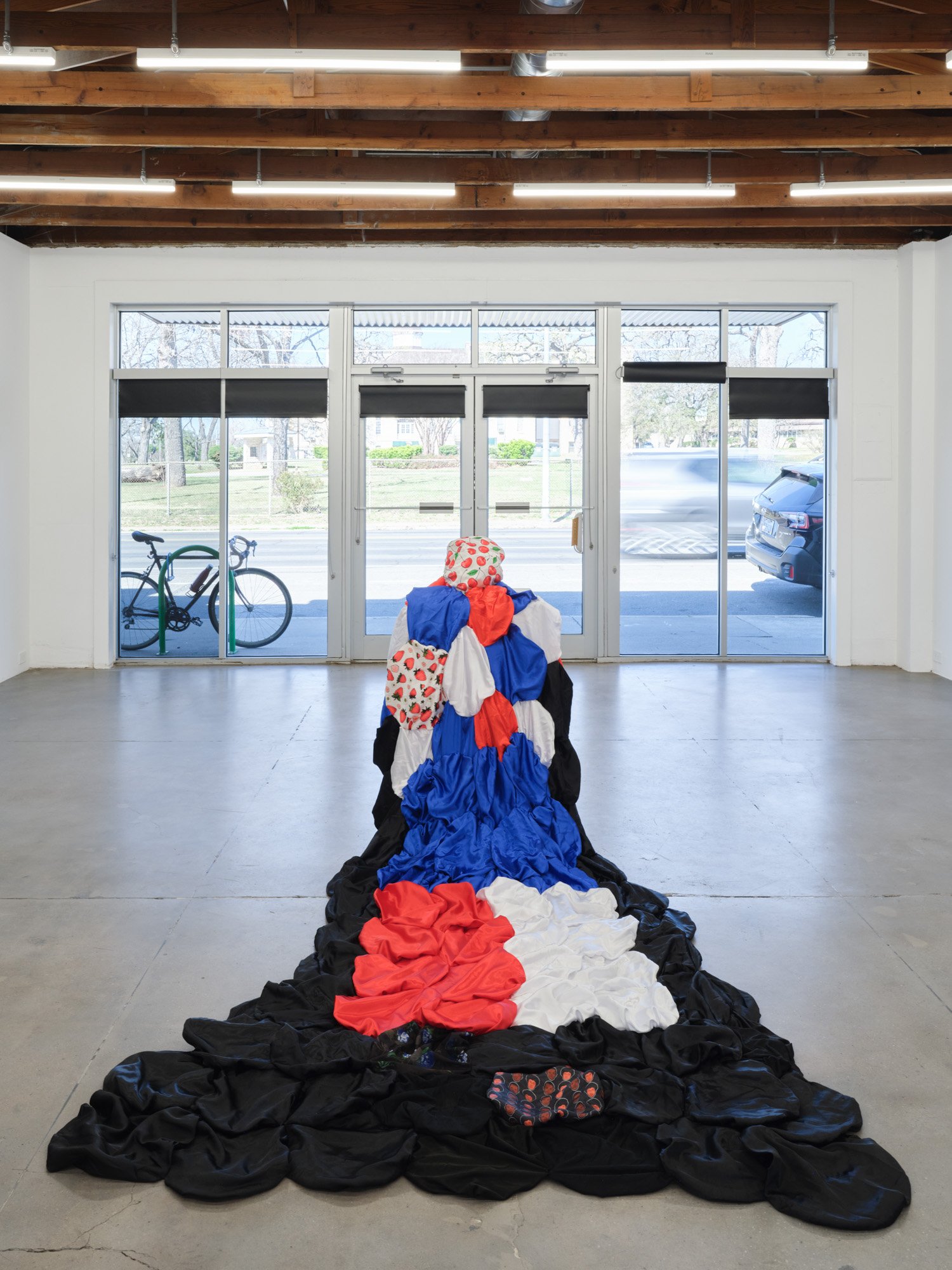 Cindy Elizabeth 
Heritage, 2026 
Installation of bonnets, thread, and ceramic cast of wig head 
Cape: 10 x 6 feet; Ceramic head:9 x 4 inches