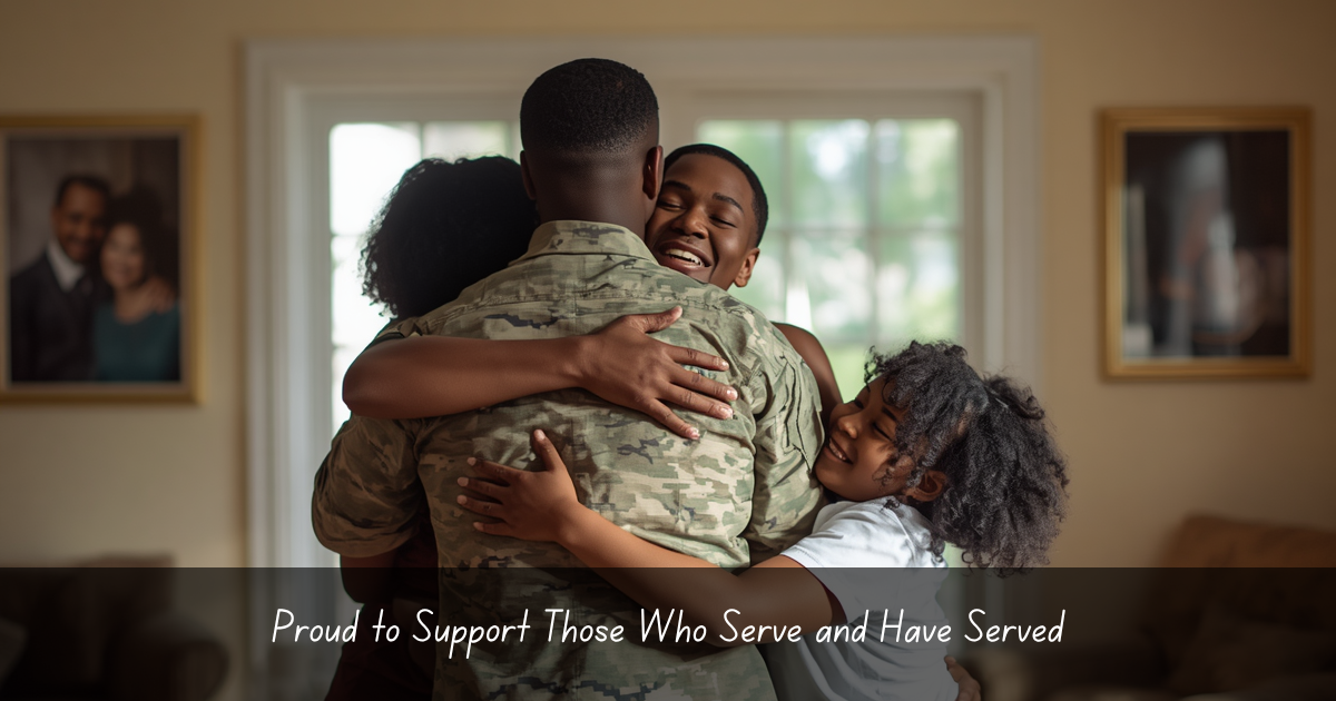 A soldier embracing a woman and two children in a warm family hug inside a home.