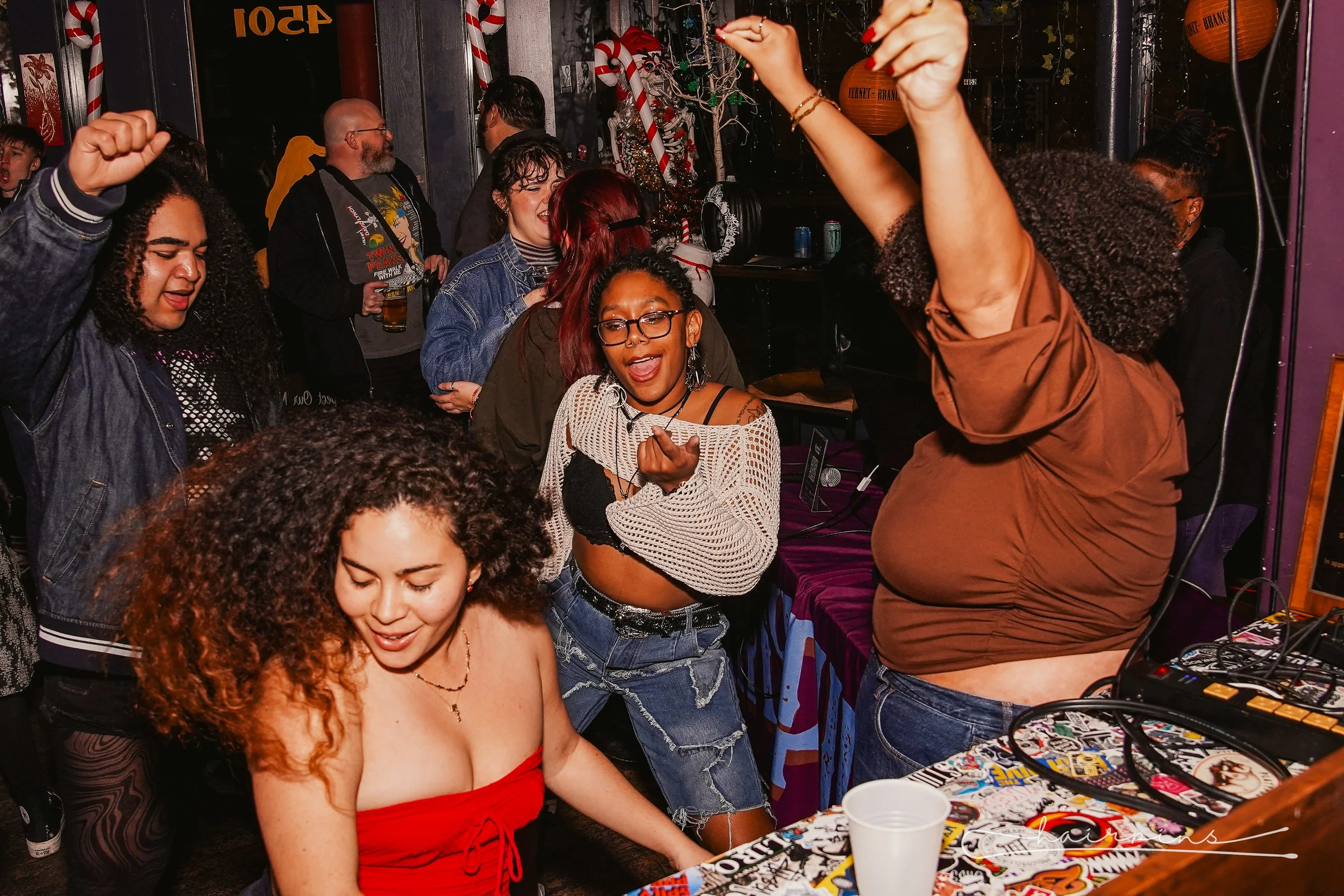 Group of people dancing and having fun at a lively party or nightclub