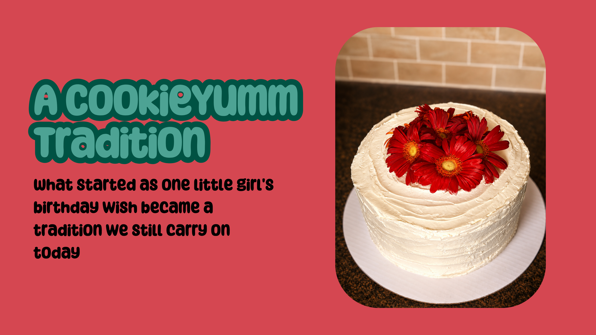 A cake with white frosting decorated with red flowers on top, placed on a white plate on a dark countertop with a brick wall background.