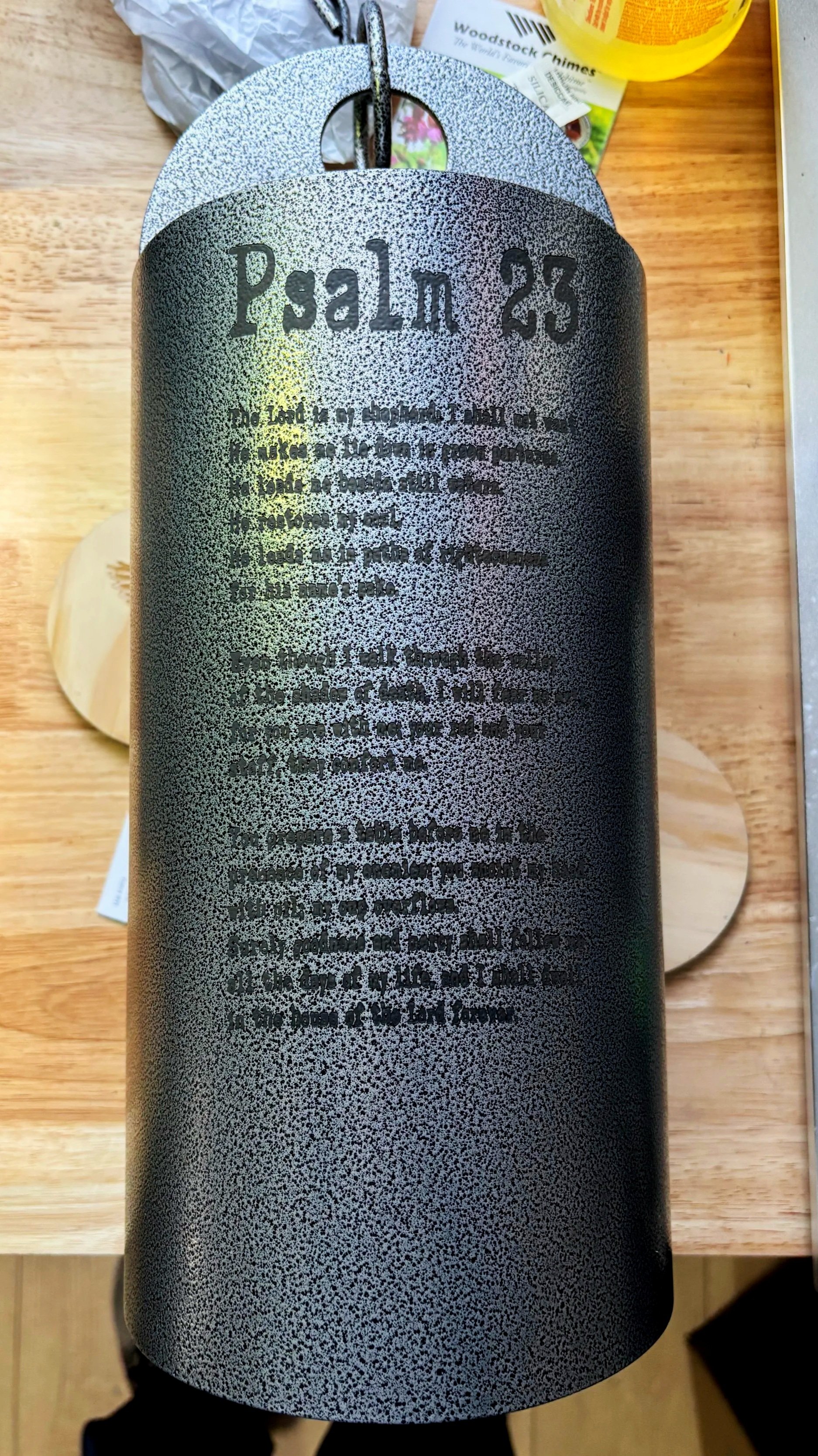 This custom-engraved wind chime was crafted to honor a life well lived and deeply loved. Featuring the full text of Psalm 23, each line etched into metal becomes a quiet echo of faith, comfort, and remembrance. 