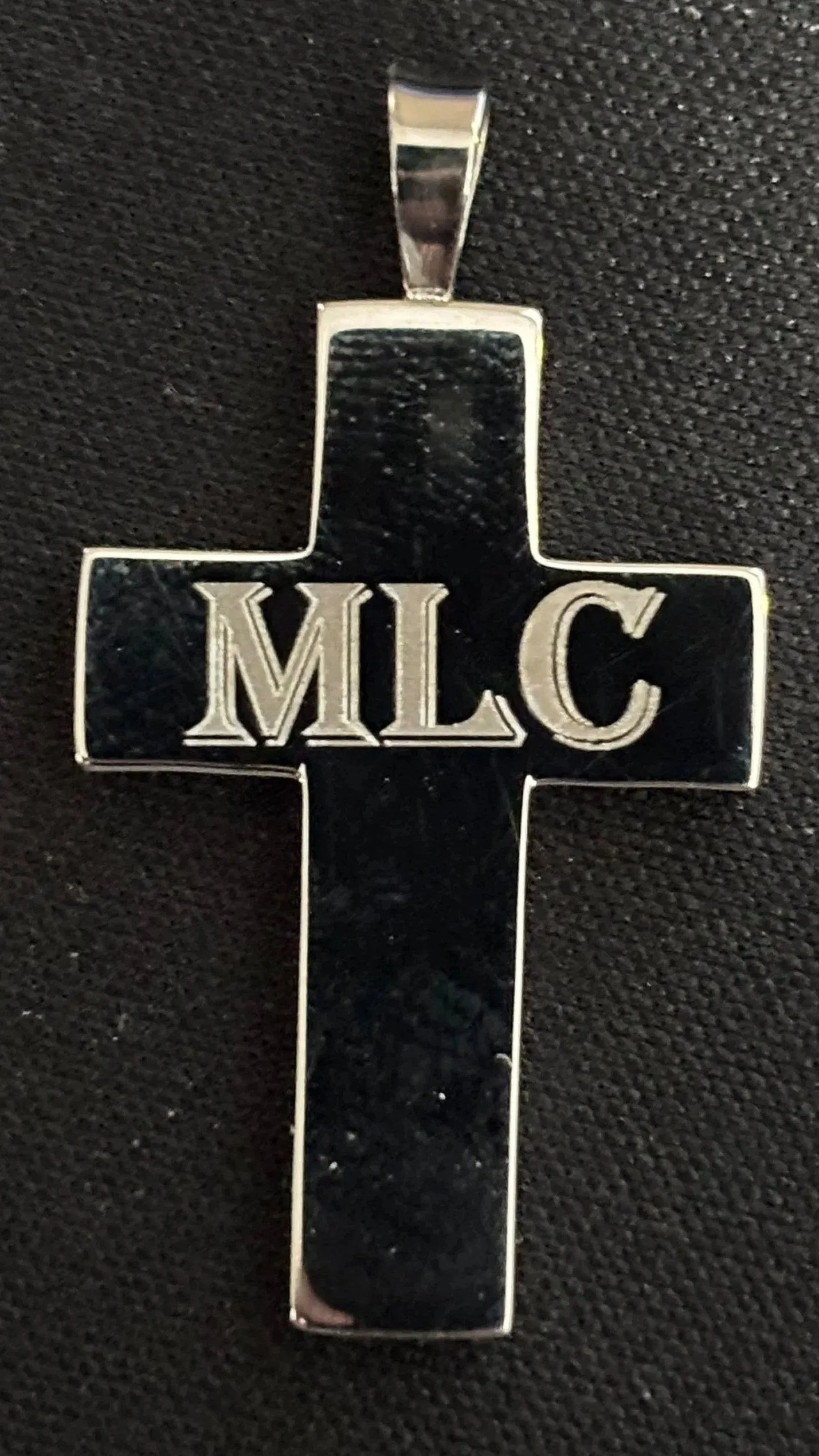 This custom-engraved cross was created to honor a loved one whose presence still guides and inspires