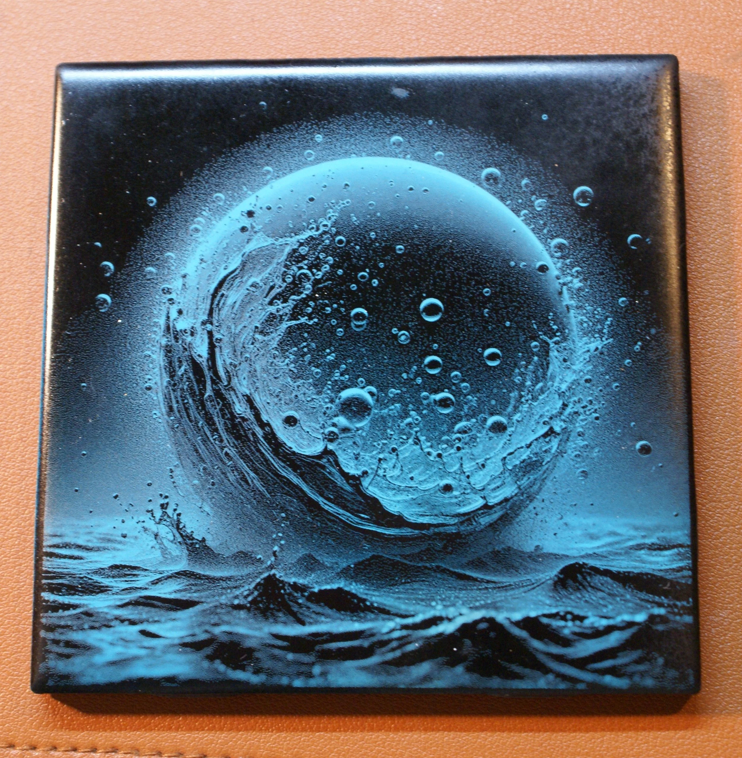 A surreal artwork depicting a large blue planet with bubbles, waves, and water splashes surrounding it, on a black background.