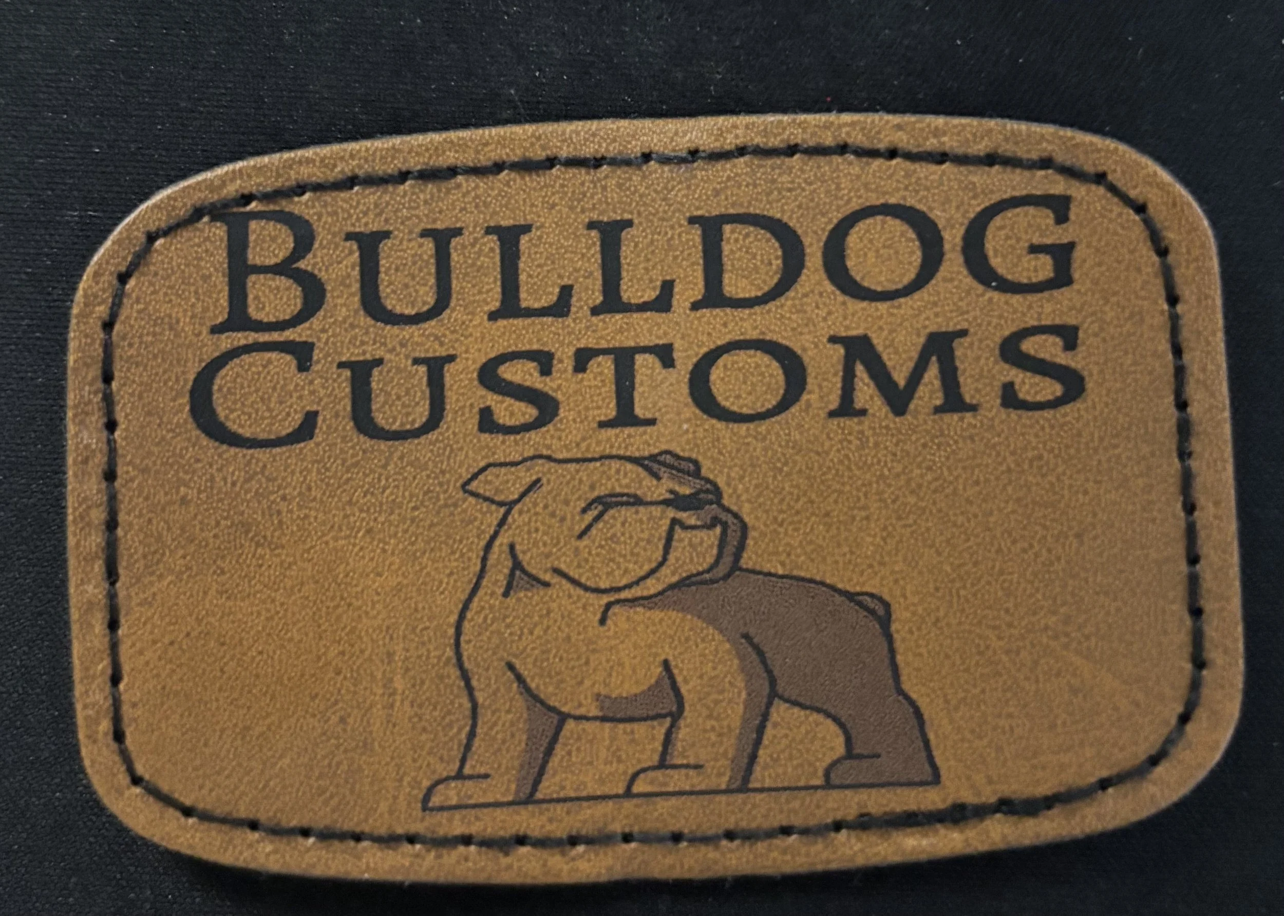 Leather patch with the text 'Bulldog Customs' and an illustration of a bulldog.