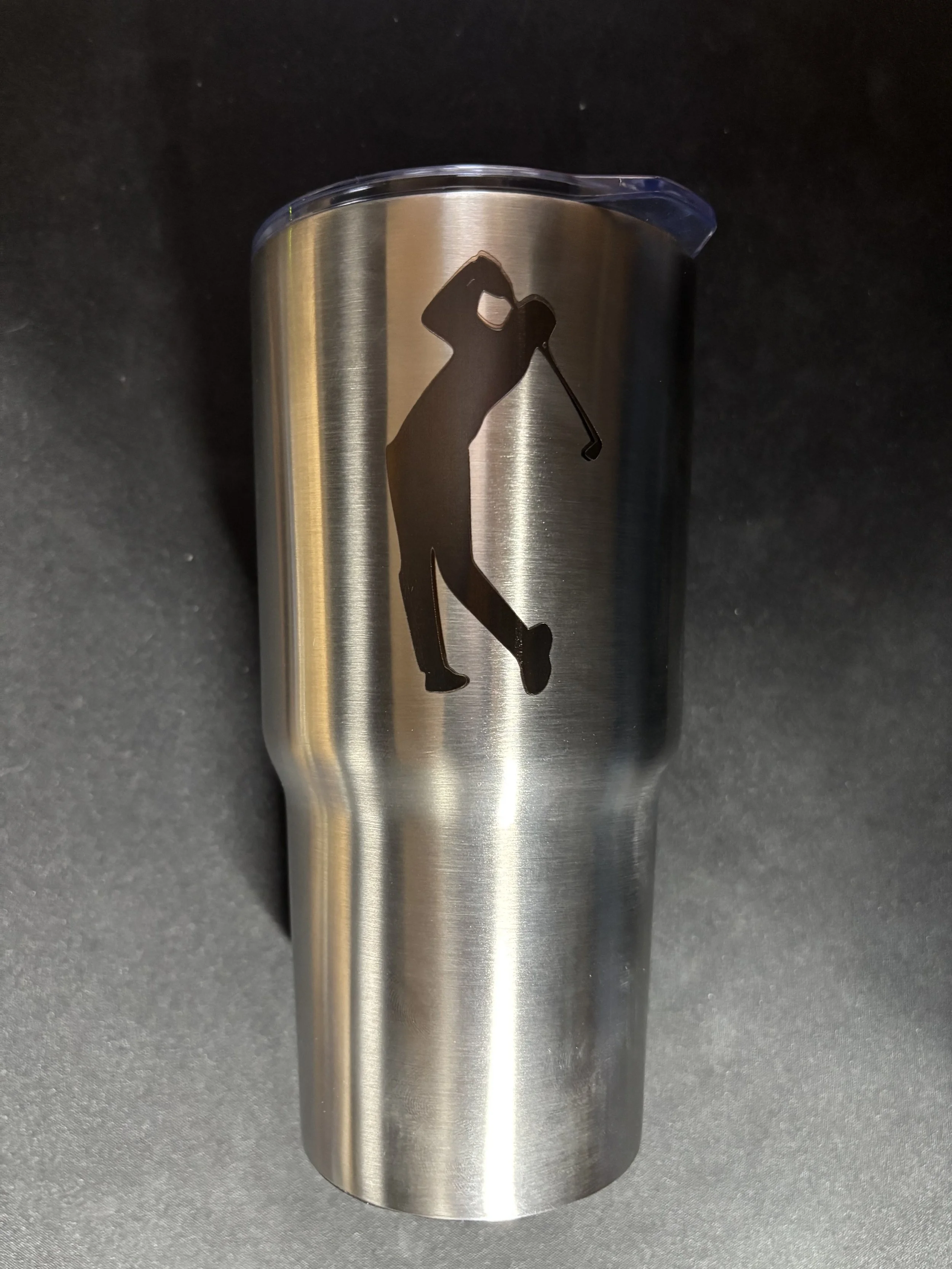 Stainless steel tumbler with a black silhouette of a golfer taking a swing.