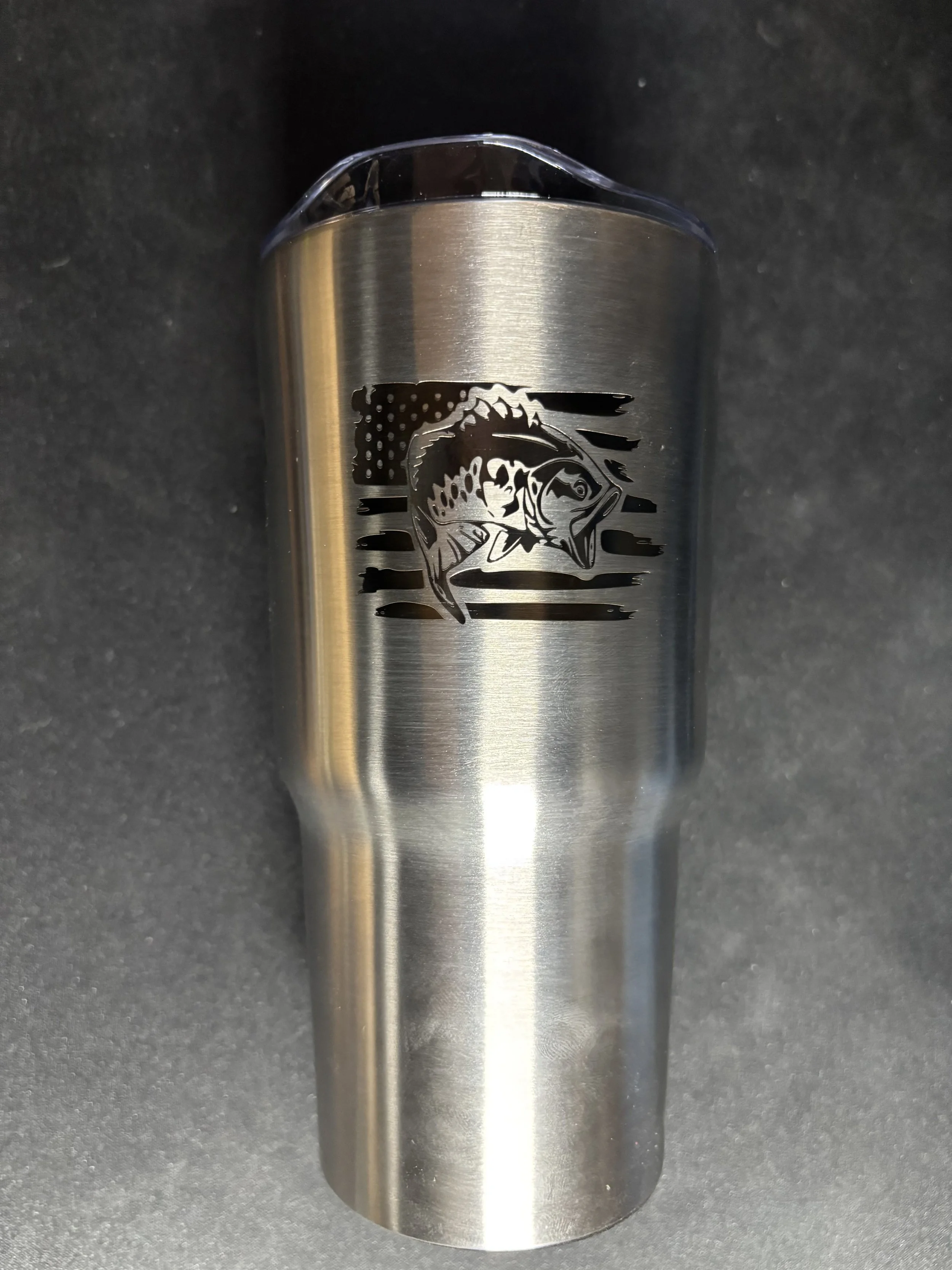 Stainless steel tumbler with a fish and American flag design