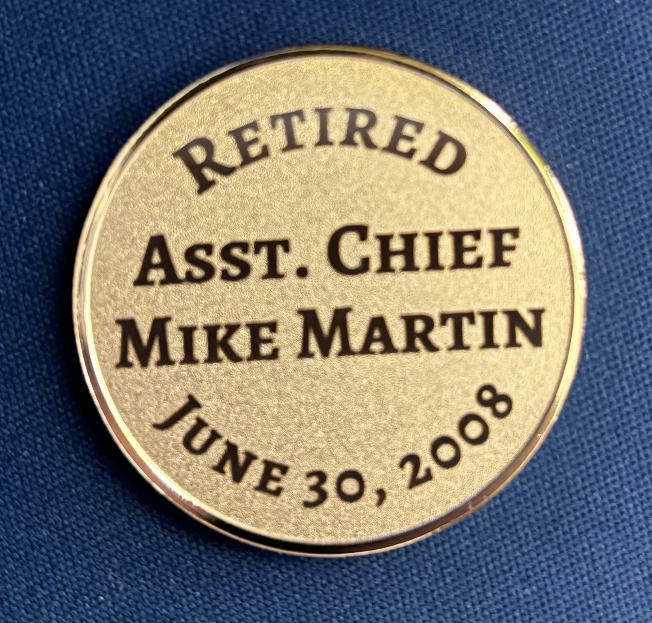 Medallion commemorating Mike Martin's retirement on June 30, 2008, with gold color and black text.