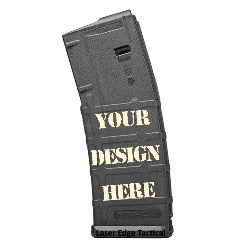A black firearm magazine with the words "Your Design Here" in beige stencil font, and the text "Laser Edge Tactical" at the bottom.