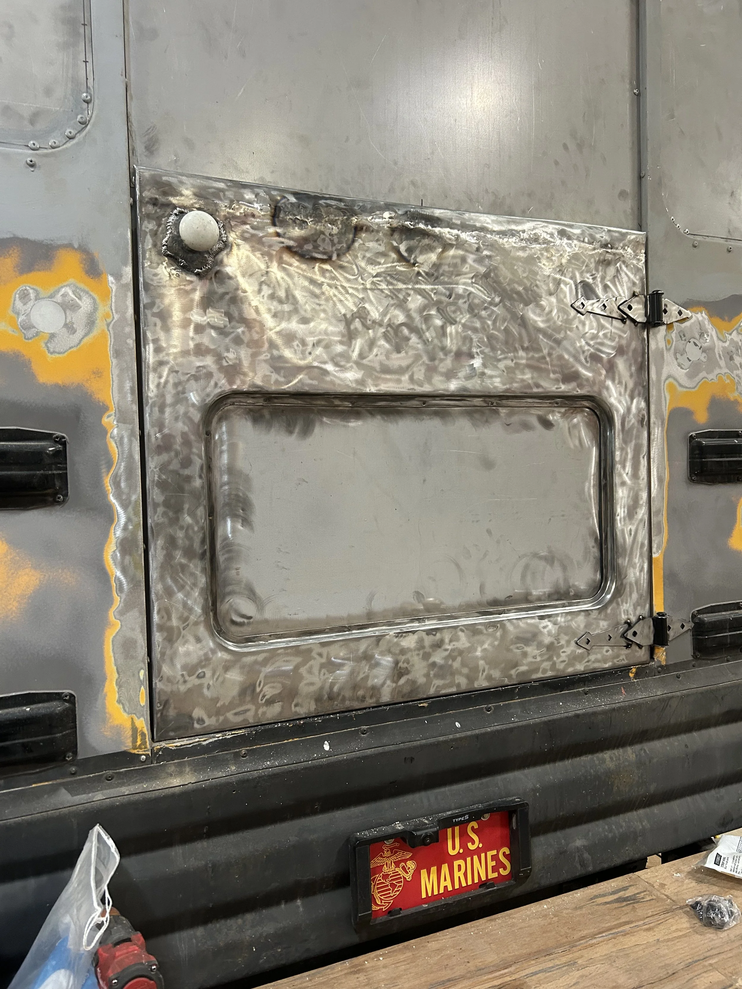 Bus Hatch door with custom door knob plate - Designer and Fabricator