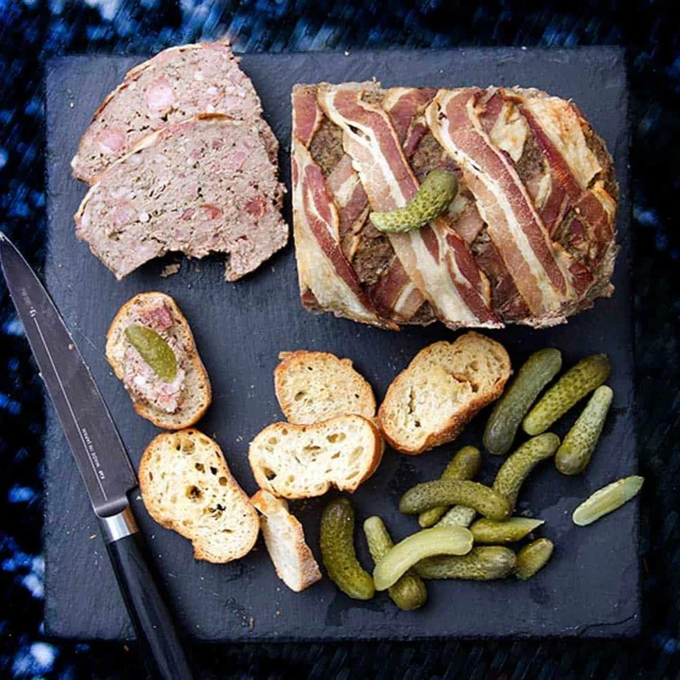 P&acirc;t&eacute; Grand-M&egrave;re &mdash; a rustic country p&acirc;t&eacute; with chicken livers.
Traditionally made, rich in flavor, and beautifully served on black slate with tartines and crisp cornichons. A true taste of the French countryside. 