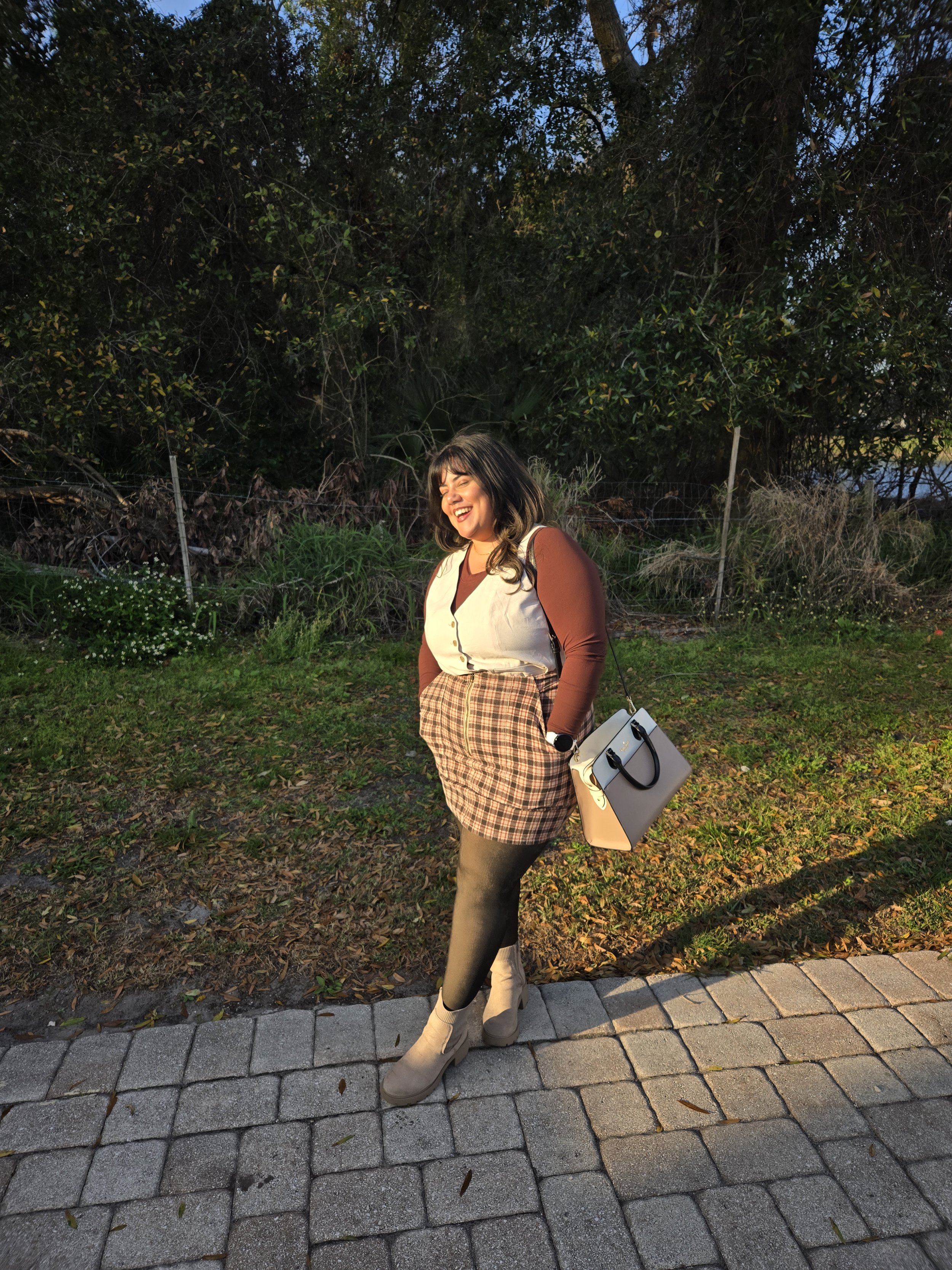 Briggiette smiling with a forest in the background