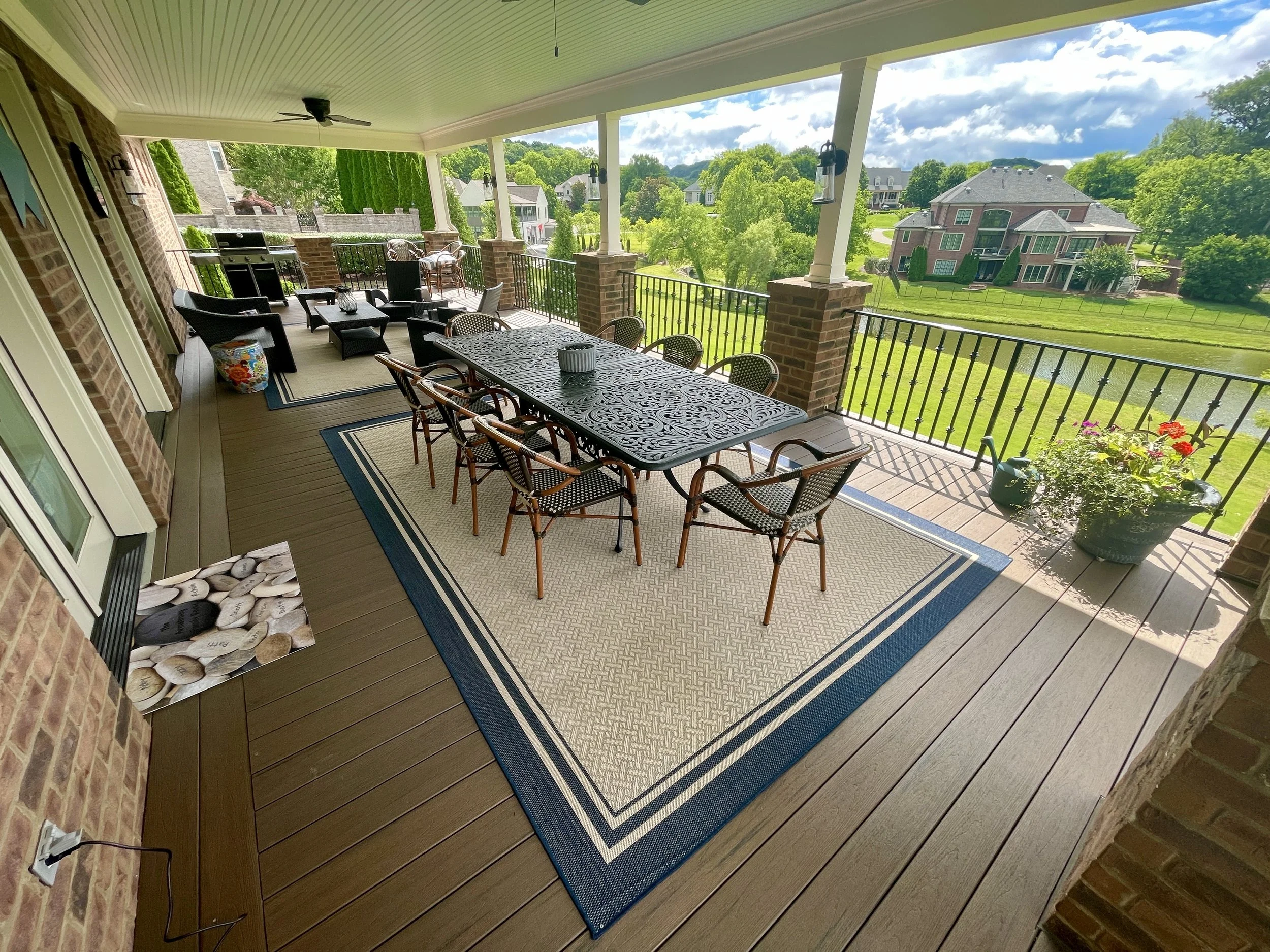 After picture showcasing a large resurfaced deck with new TimberTech composite decking and black aluminum railings built by Deck Craft in Legends Ridge, Franklin, Tennessee