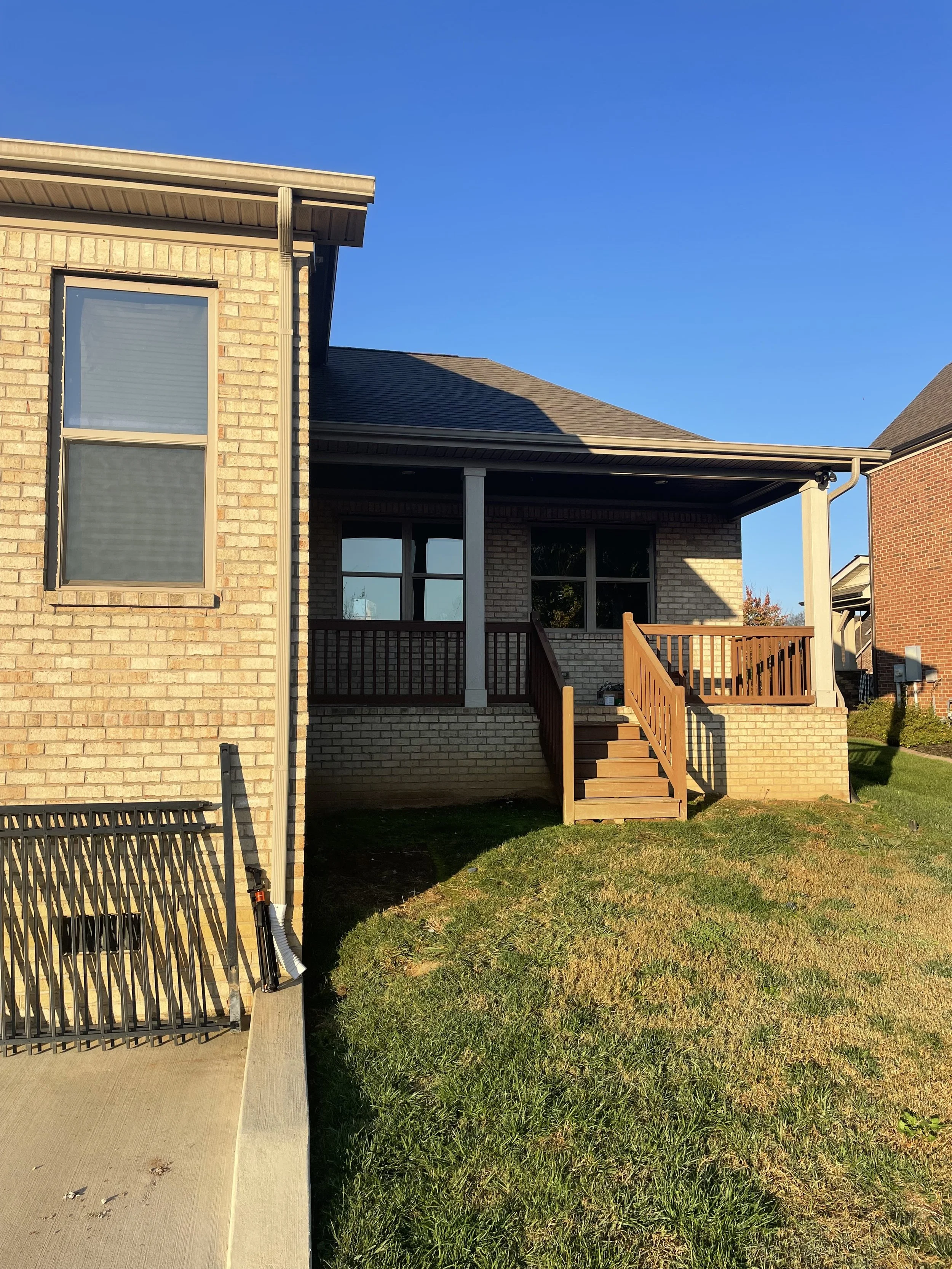 Before picture showcasing a small backyard porch before Deck Craft Installed a New TImberTech Deck in Spring Hill, TN