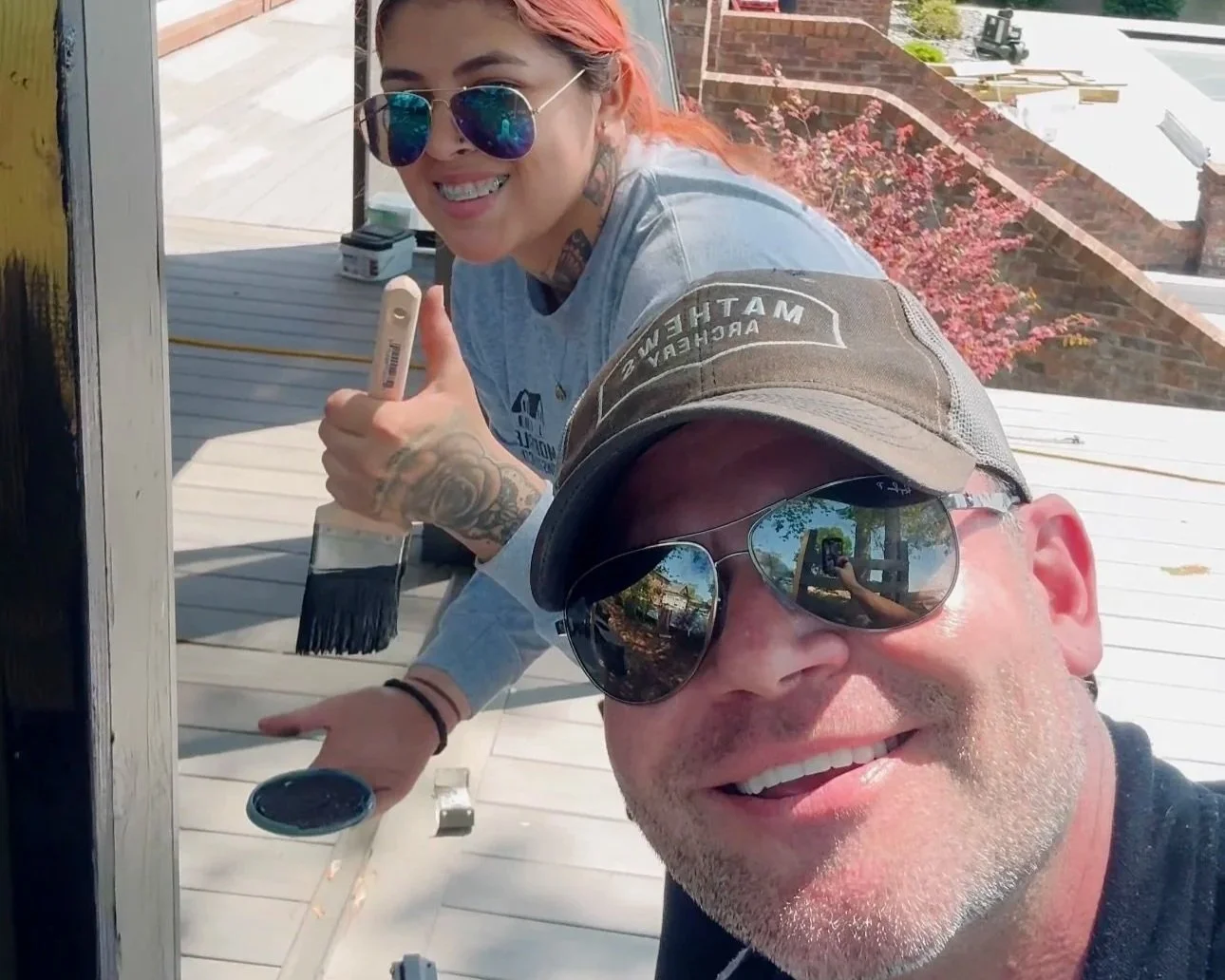 Deck Craft Owner with his worker staining a deck in Hendersonville, TN on Old Hickory Lake