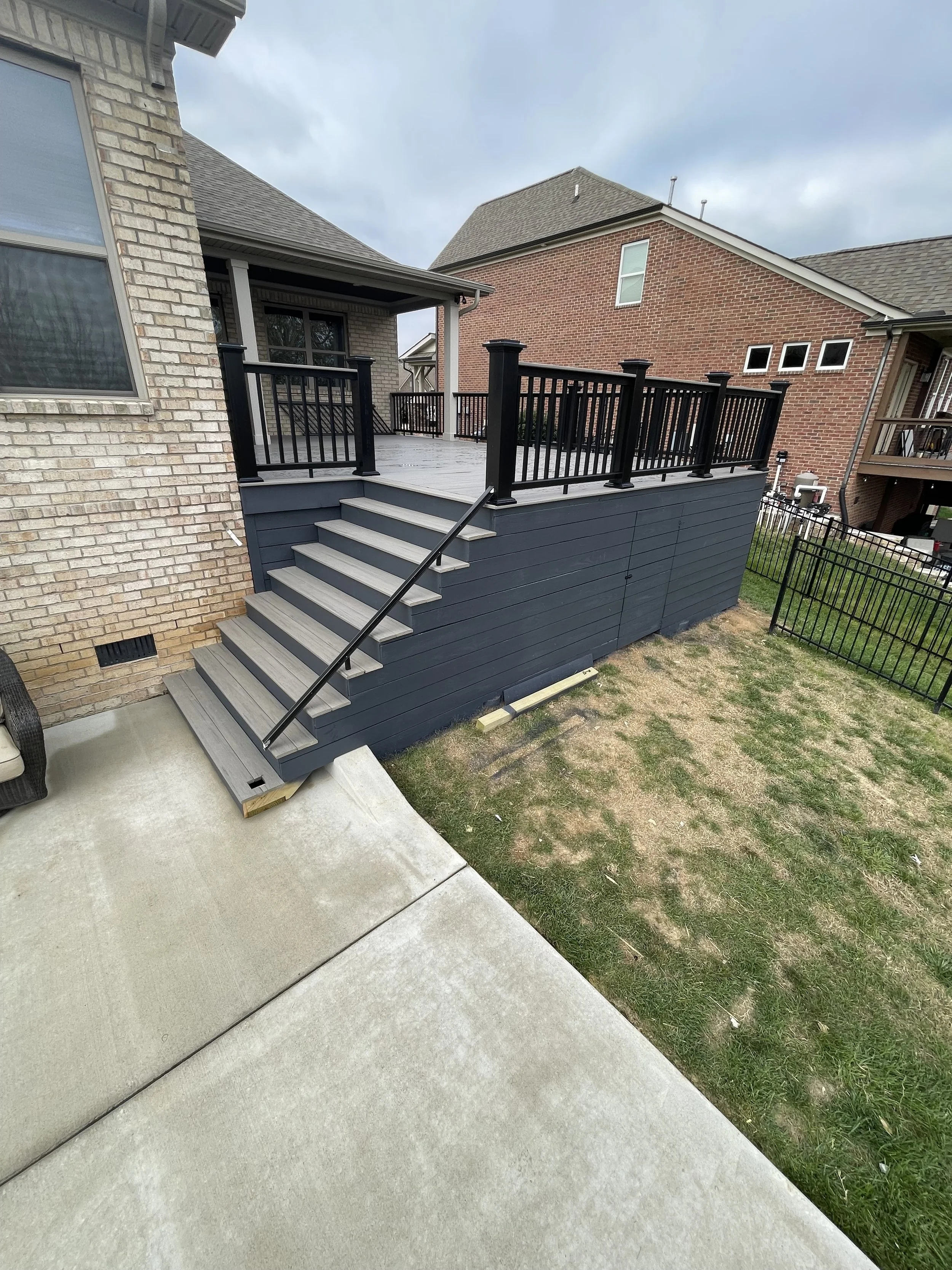 After picture showcasing a TimberTech Deckwith new composite decking and black composite railings built by Deck Craft in Spring Hill, Tennessee