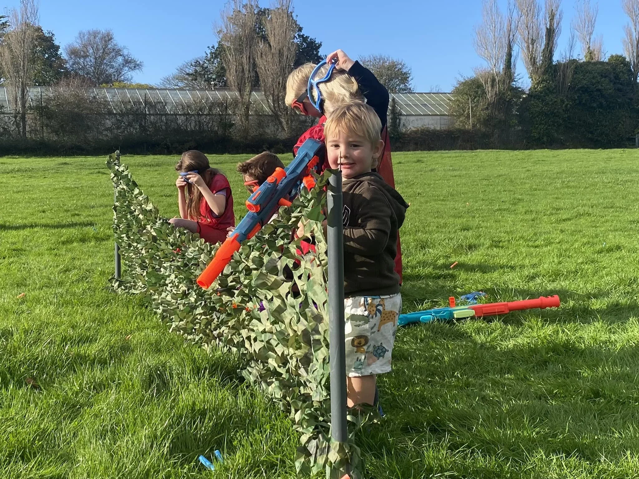 Exciting NERF battle during a kids' birthday party in Guernsey.