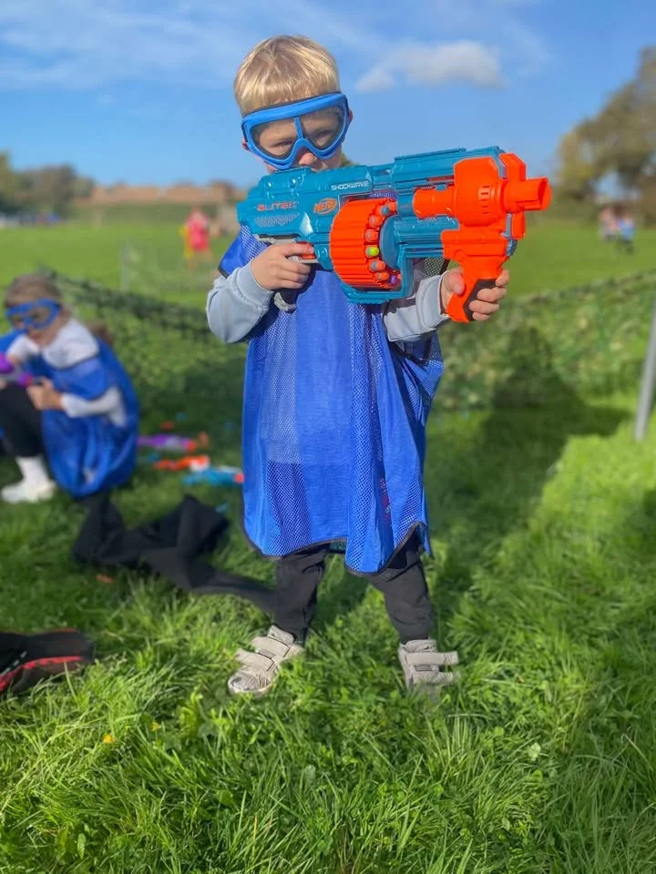 Player aiming with a NERF blaster during a competitive match.