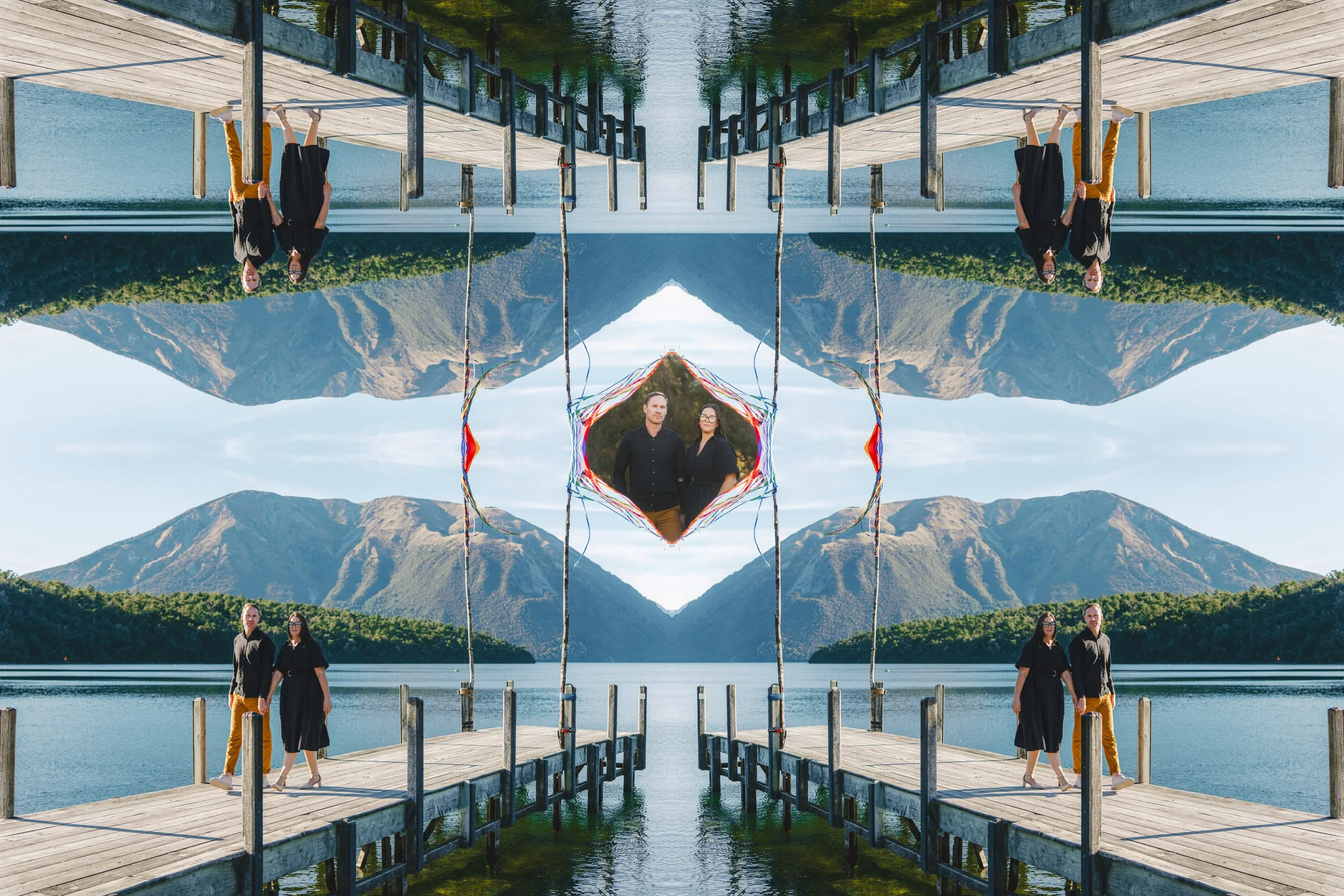 Mirror image of a lakeside pier, mountains in the background, with two people standing on the pier, and a central decorative frame with two people, creating a symmetrical and kaleidoscopic visual effect.