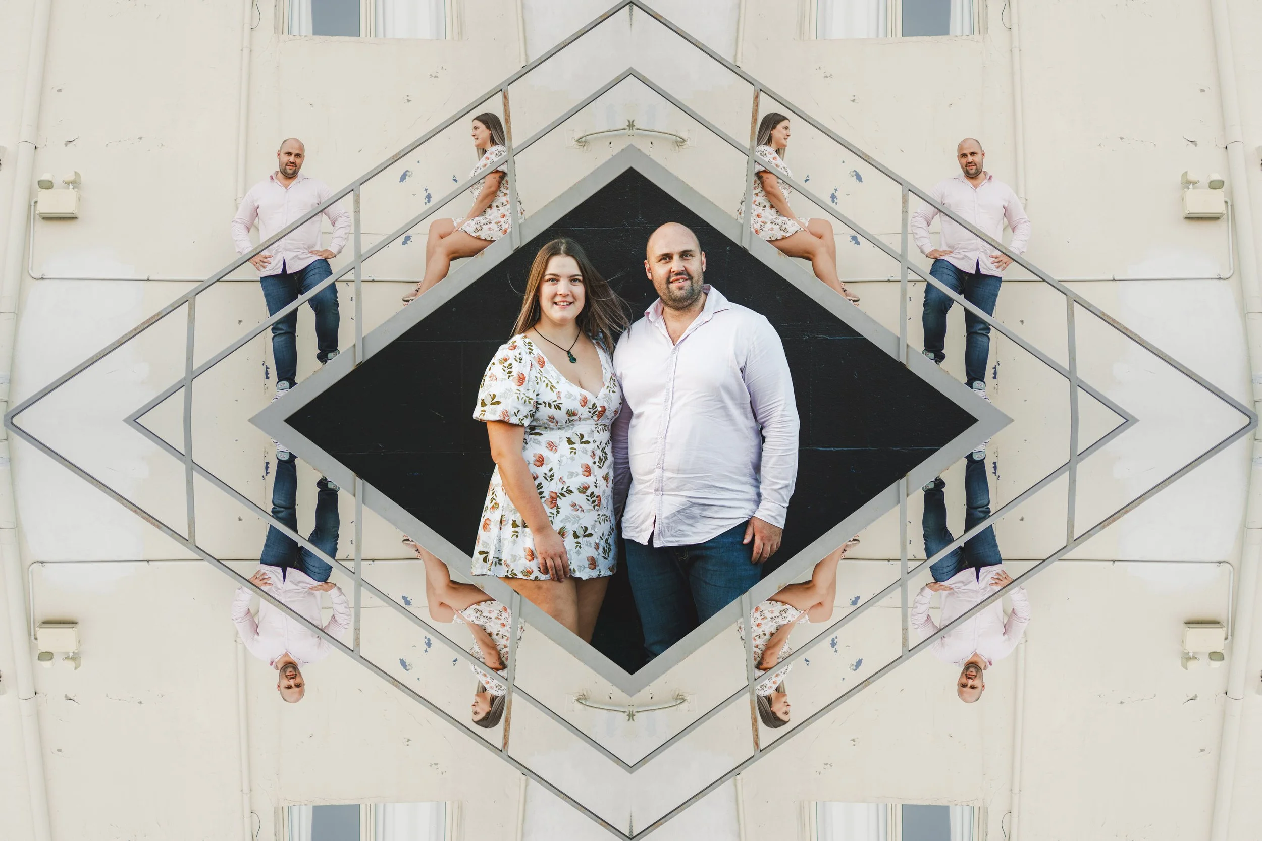 A mirrored geometric pattern with a central photo of a smiling couple standing outside, with identical pairs of people sitting on the stairs behind and reflected in the mirror.