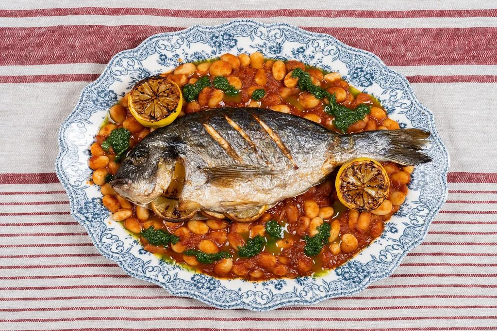 Whole sea bream, butter beans, salsa verde