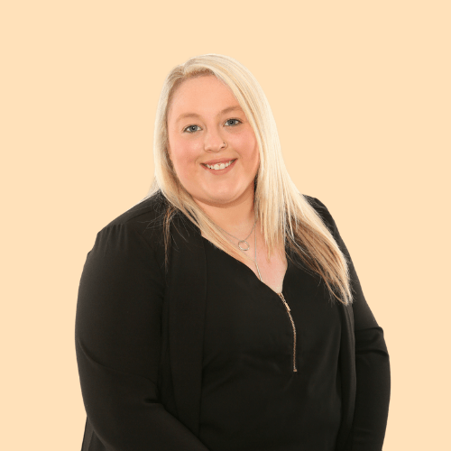 Woman smiling as she is happy that she has finally published her new Squarespace website.