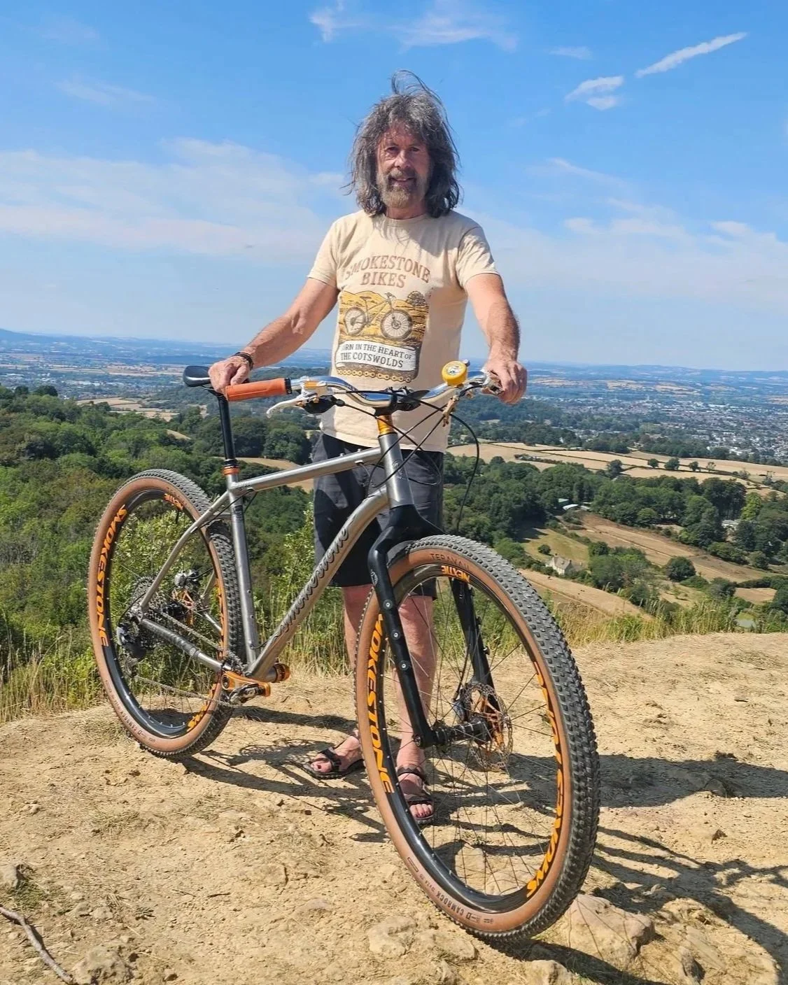 Rider with the Smokestone Raven 32 32-inch titanium mountain bike