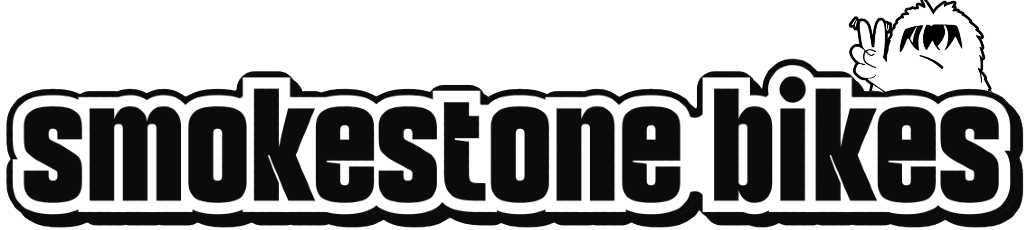 Logo for Smokestone Bikes featuring stylized text and a cartoon character making a peace sign