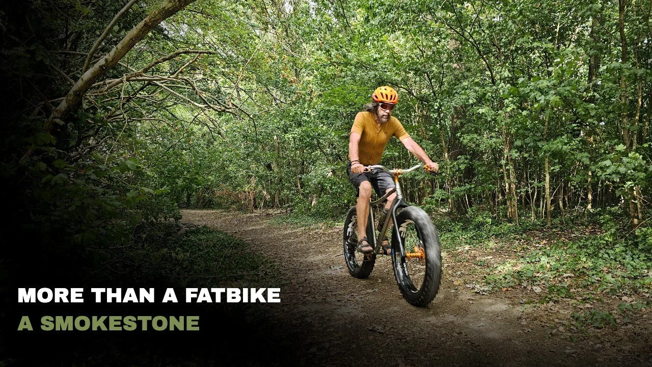 Smokestone BowTi titanium fat bike riding on a trail
