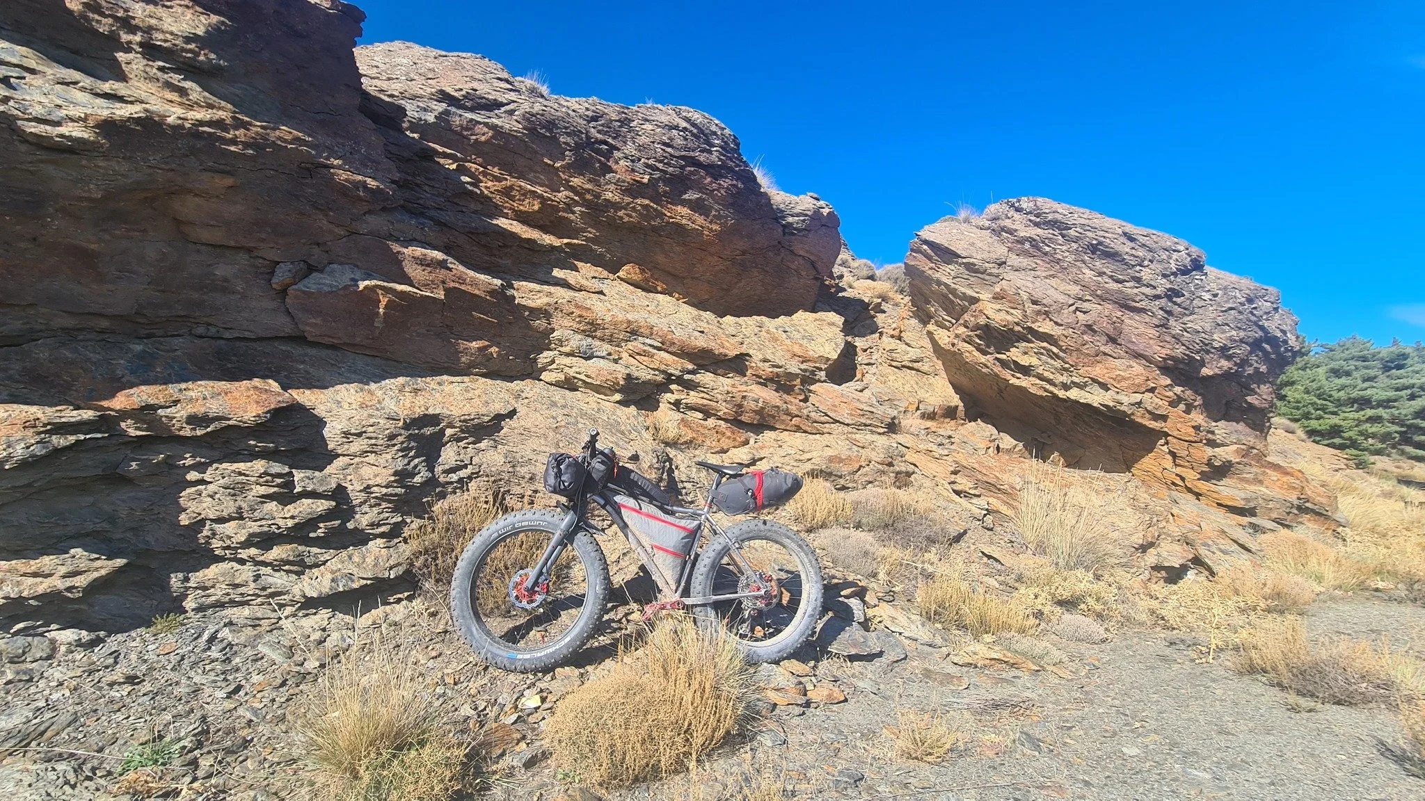 Smokestone BowTi titanium fat bike loaded for bikepacking
