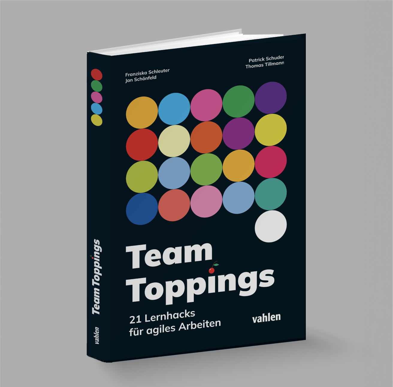 Buchcover "Team Toppings" mit bunten Kreisen und dem Untertitel "21 Lernhacks für agiles Arbeiten" von Vahlen Verlag.