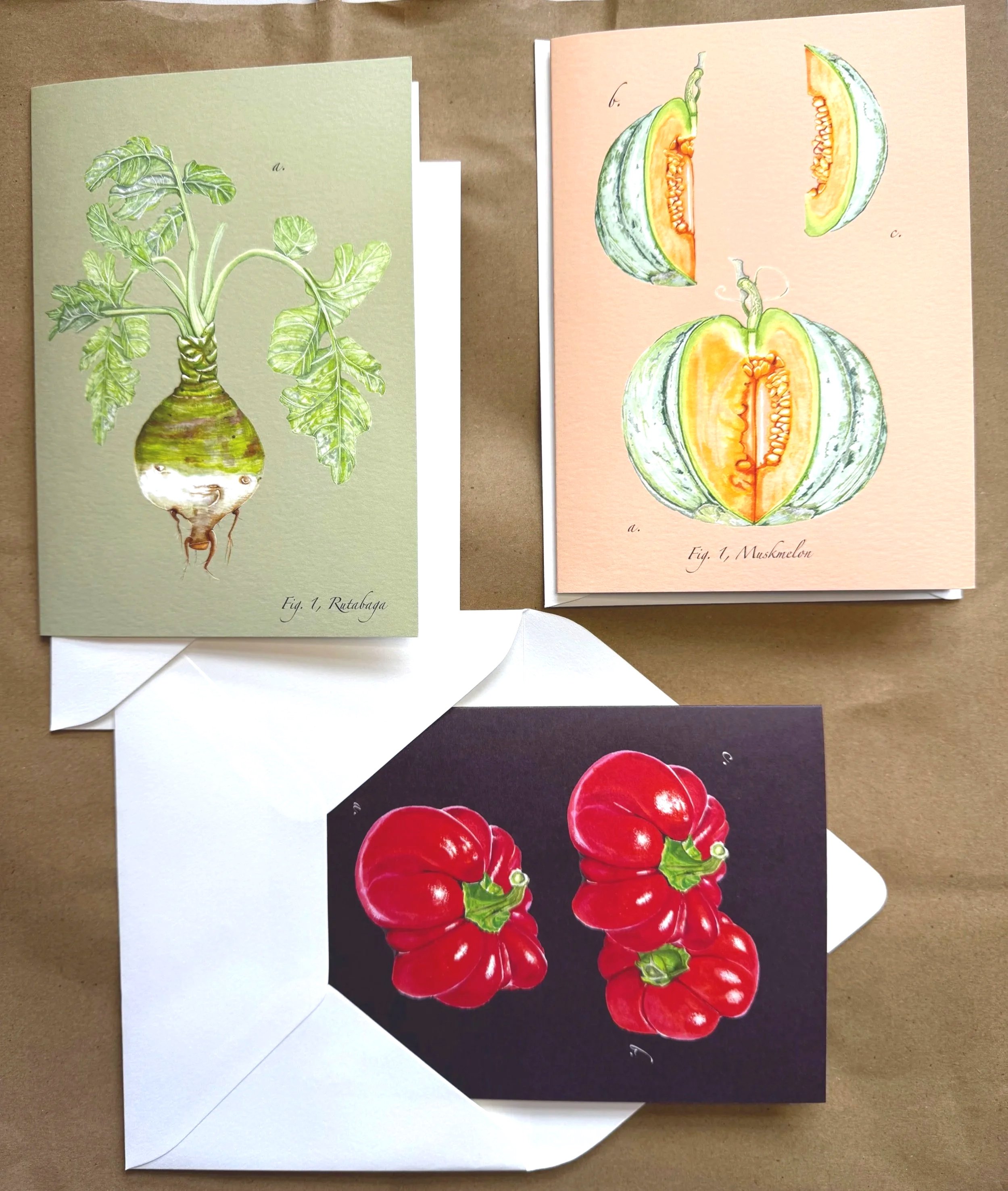 Colorful illustrations of a root vegetable with green leaves and a divided watermelon showing orange flesh and seeds, and a bunch of red bell peppers.