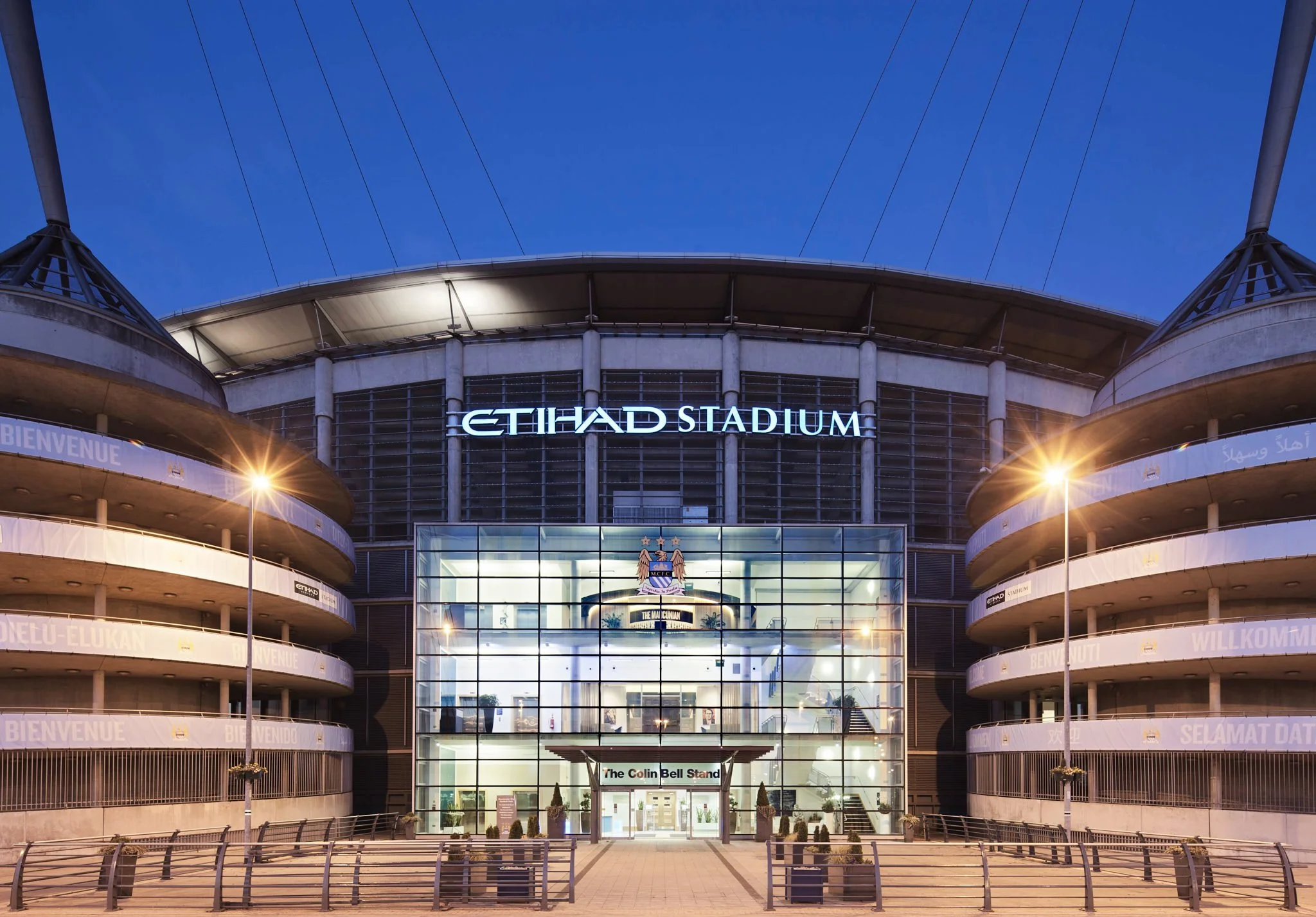 Entrance to Manchester City ground Etihad Stadium at night, photography by Premier Stadium Images