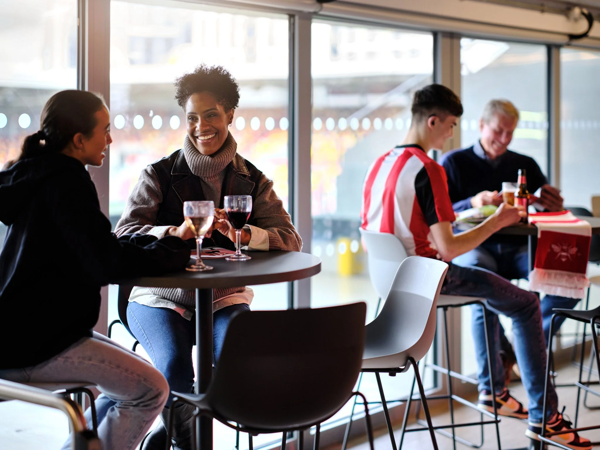 Restaurant Bar at Brentford FC Gtech Community Stadium with fans, photography by Premier Stadium Images