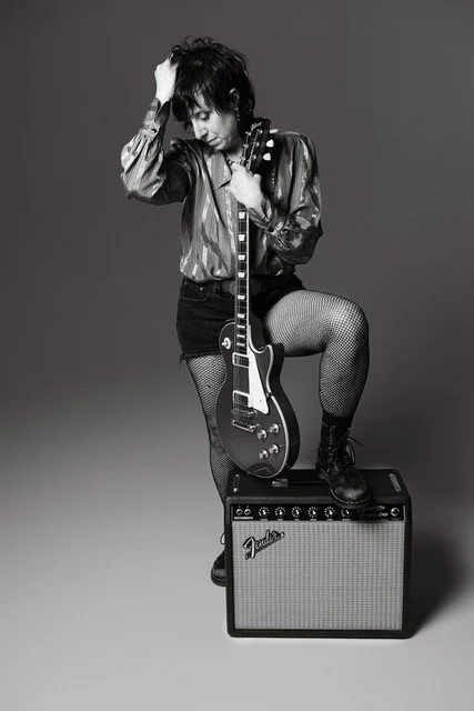 Jojo -Cai- Bn'W Standing with guitar (1).jpg