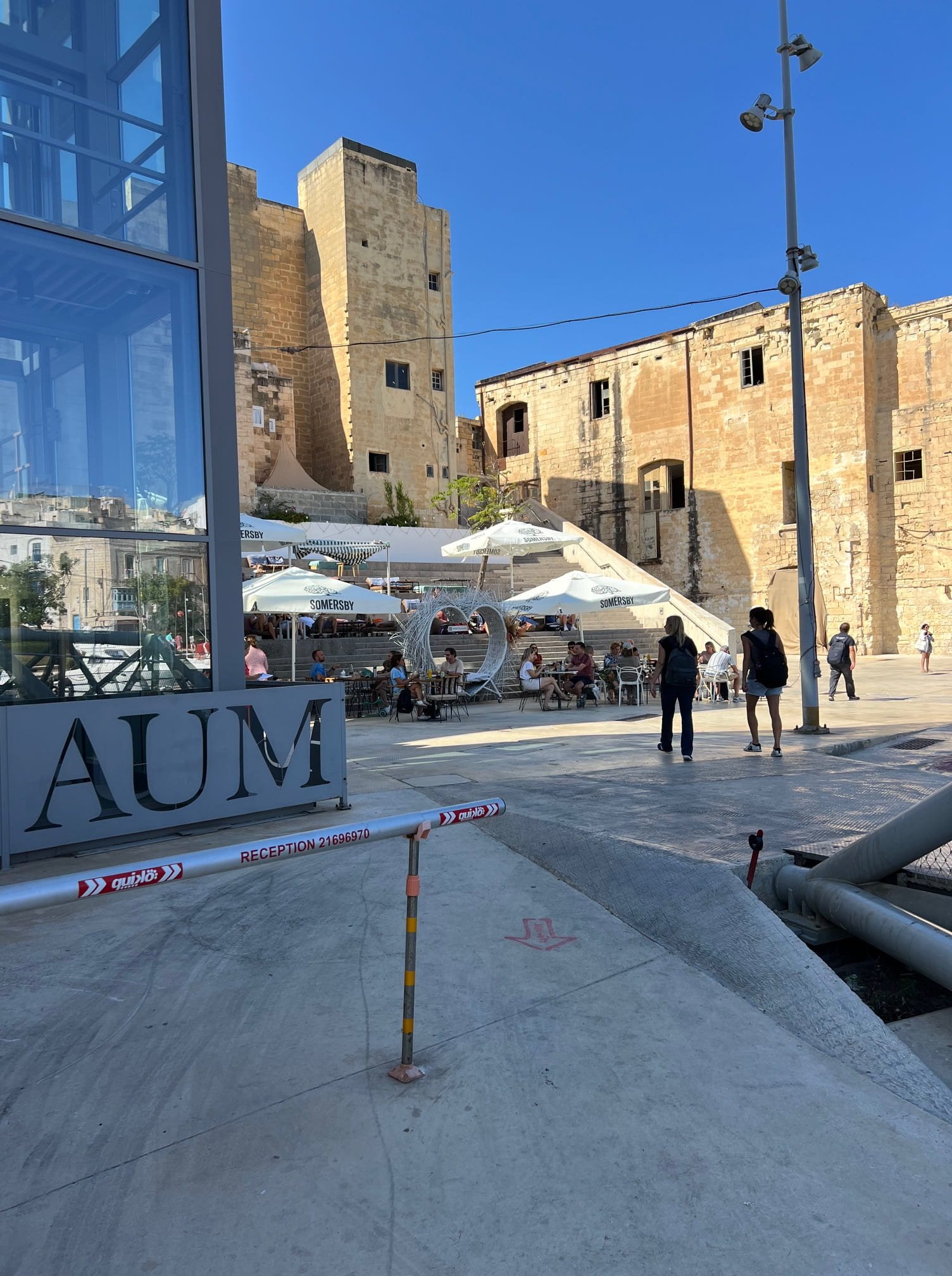 Outdoor seating area of DATE Art Café in Cospicua near the American University.