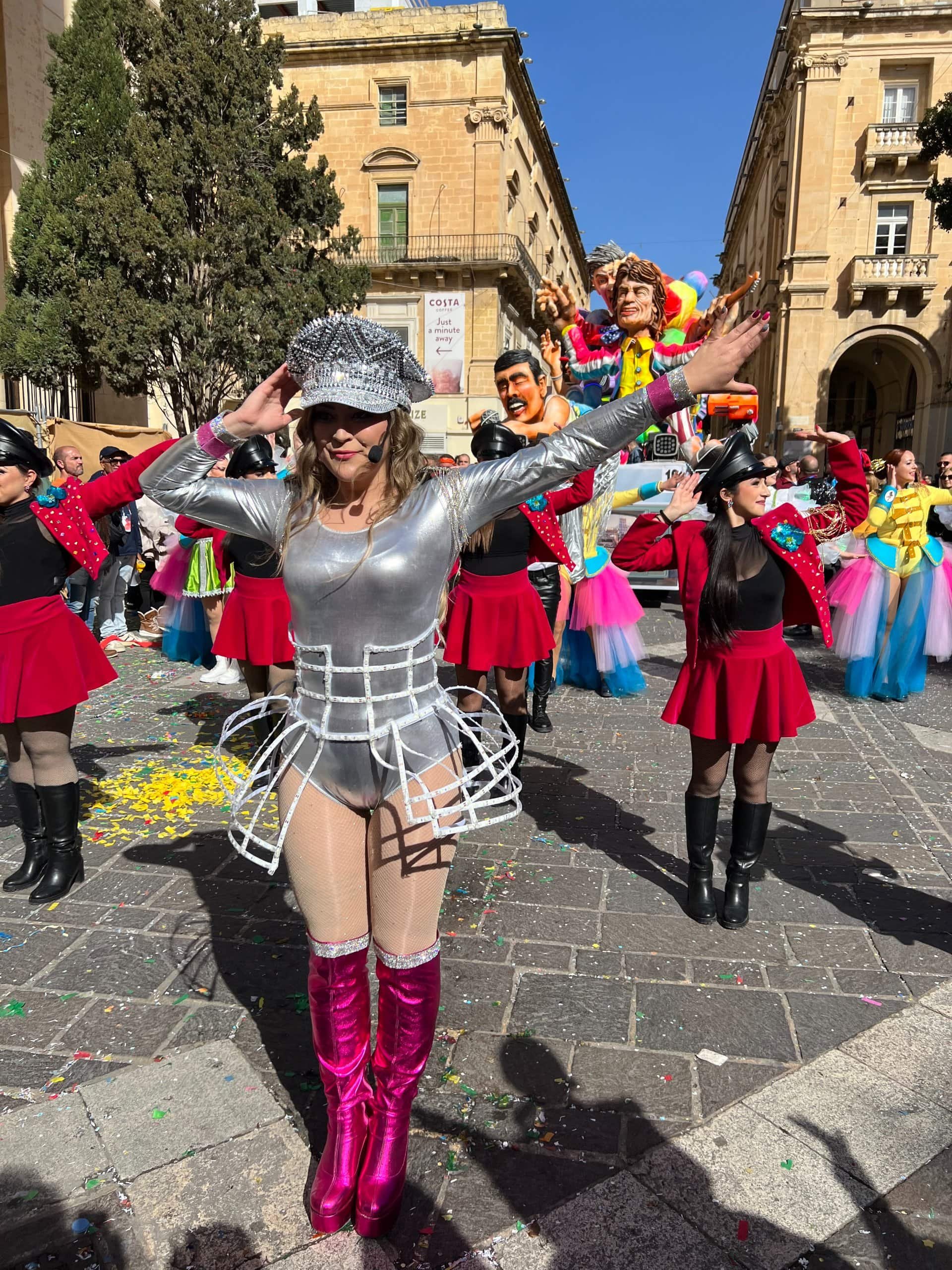 Carnival dancer posing in the crowded streets of Valletta.