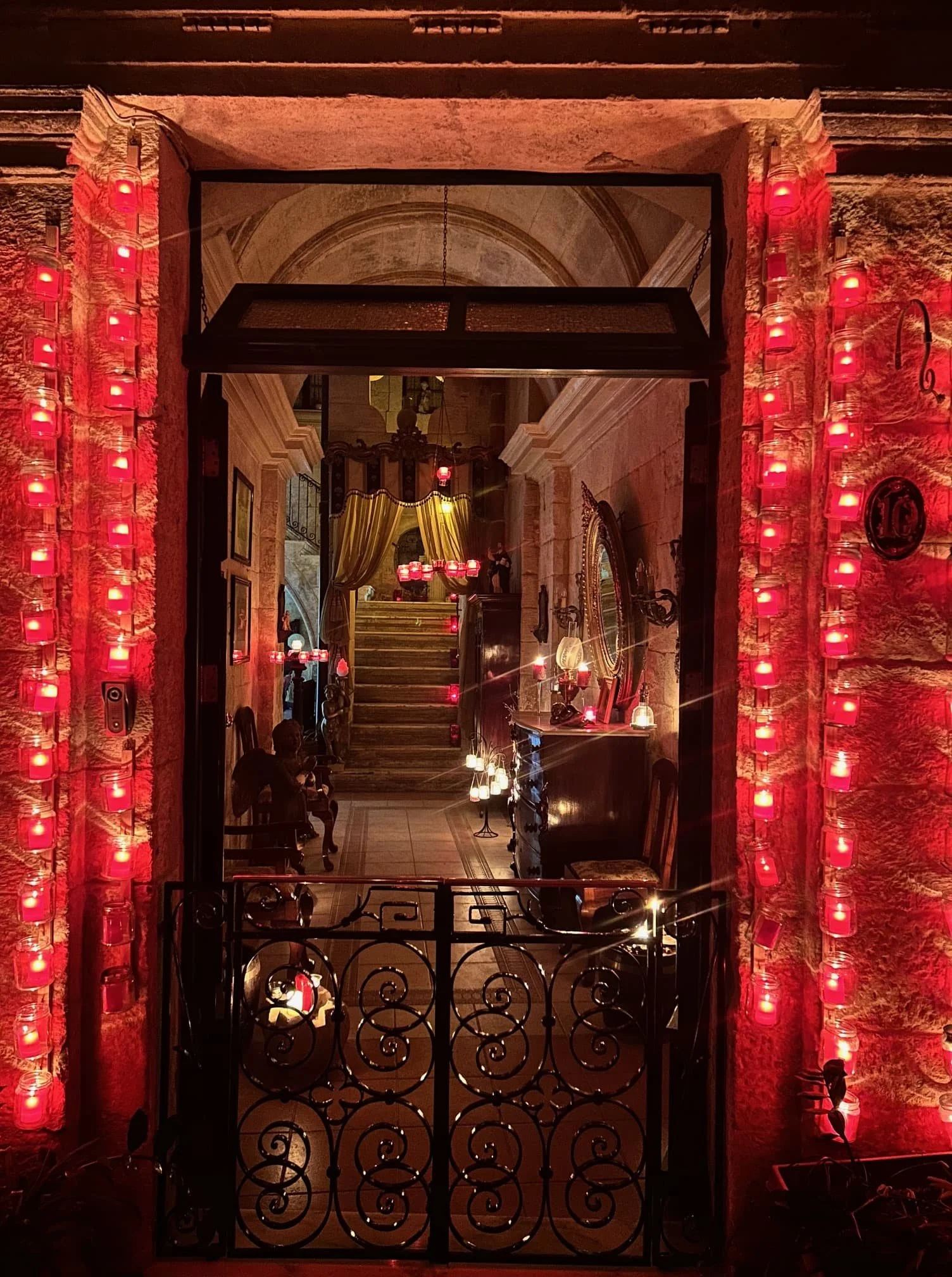 A traditional Maltese house entrance in Birgu lit by candles during the festival.