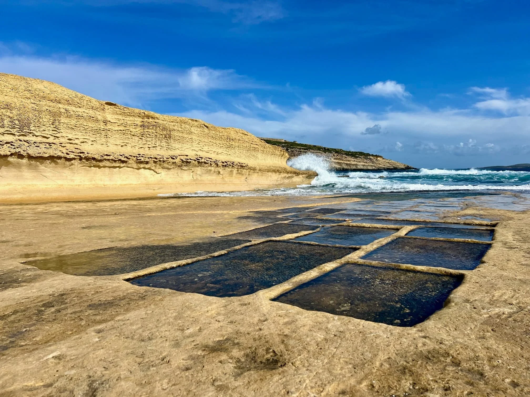 Geometric salt pans carved into the rock near Ras il-Hobz, Gozo.