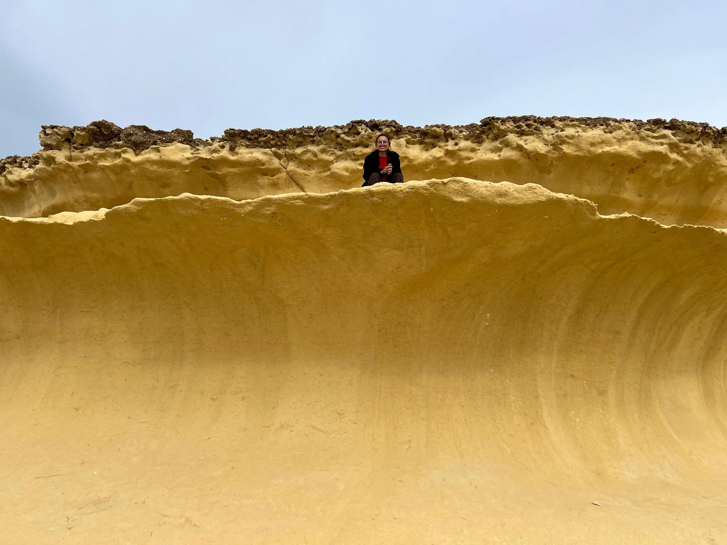 Unique yellow limestone rock formations known as the Sand Waves on the island of Gozo.